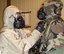 Reservists in the 476th Fighter Group, Moody Air Force Base, Ga., train using gas masks and chemical protection suits in preparation for a deployment to Afghanistan in September 2010. Twenty-five reservists from the group will deploy with Regular Air Force Airmen from Moody's 23rd Fighter Group.  (U.S. Air Force photo/Tech. Sgt. Katie Brown)