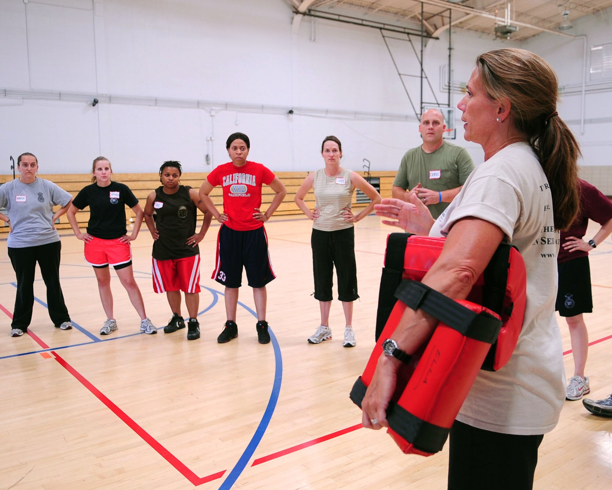 DAVIS MONTHAN AIR FORCE BASE Ariz. - Kathy Wright, staff instructor for The Rape Aggression Defense Systems, explains some defense maneuvers during a R.A.D. certification course at the Haeffner Fitness Center here Sept. 14, 2010. The R.A.D. System is a comprehensive course that begins with awareness, prevention, risk reduction and risk avoidance, while progressing on to the basics of hands-on defense training. (U.S. Air Force photo/Airman 1st Class Jerilyn Quintanilla)