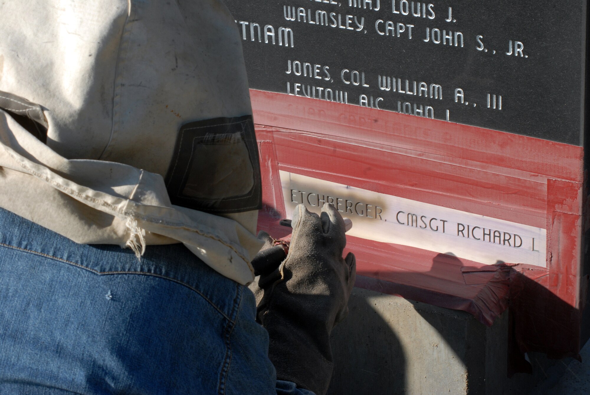GOODFELLOW AIR FORCE BASE, Texas -The name of Chief Master Sgt. Richard “Dick” Etchberger is sandblasted into the POW/MIA Memorial here Sept. 16.  Chief Etchberger was posthumously awarded the Medal of Honor for his action on March 11, 1968, when he single-handedly held off an enemy attack on Mount Phou Pha Thia at Lima Site 85 only to be fatally wounded as he was being evacuated.  President Barak Obama presented the Medal of Honor to Chief Etchberger’s family Sept. 21 at the White House. (U.S. Air Force photo/Master Sgt. Randy Mallard)