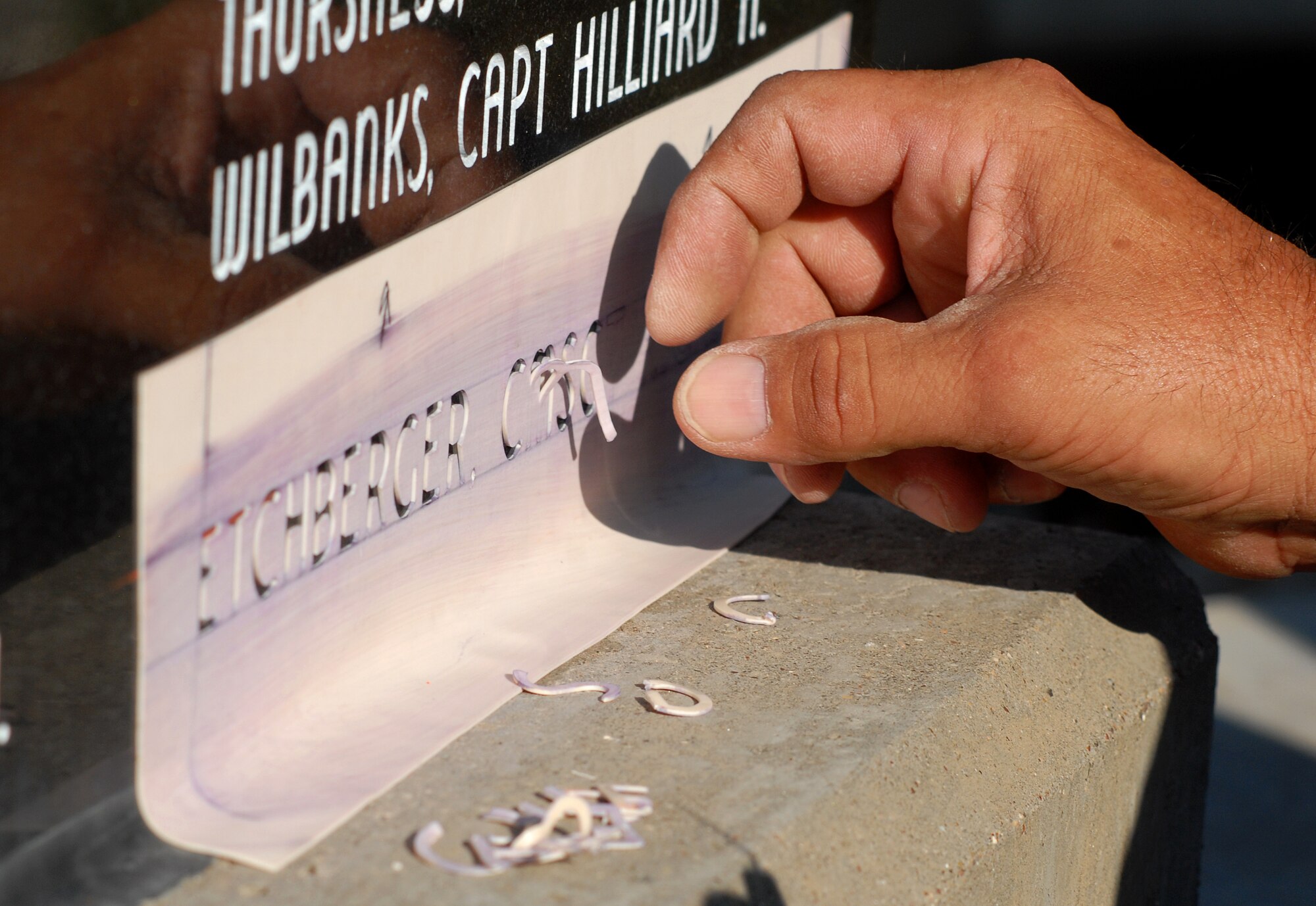 GOODFELLOW AIR FORCE BASE, Texas - A stencil with the name of Chief Master Sgt. Richard “Dick” Etchberger is prepared so it can be sandblasted into the POW/MIA Memorial here Sept. 16.  Chief Etchberger was posthumously awarded the Medal of Honor for his actions on March 11, 1968, when he single-handedly held off an enemy attack on Mount Phou Pha Thia at Lima Site 85 only to be fatally wounded as he was being evacuated.  President Barack Obama presented the Medal of Honor to Chief Etchberger’s family Sept. 21 at the White House. (U.S. Air Force photo/Master Sgt. Randy Mallard)