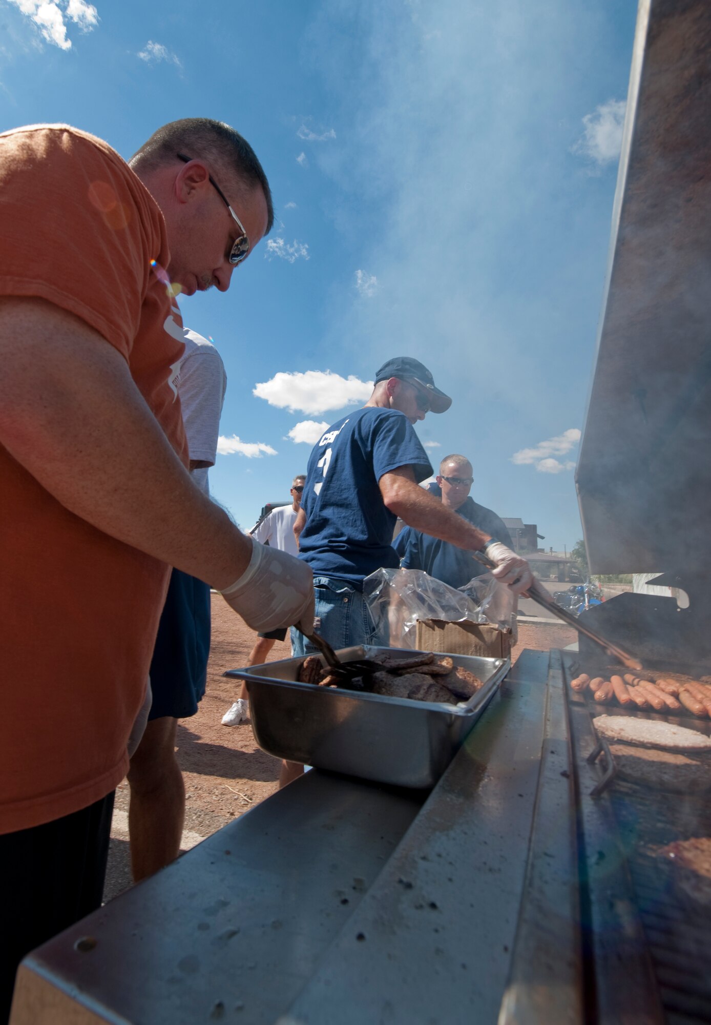 HOLLOMAN AIR FORCE BASE, N.M. -- Chiefs and First Sergeants grill hamburgers and hotdogs at Steinhoff park before the Sports Day awards presentation Sept. 17, 2010. This year, the awards presentation and cook-out coincided with the base celebration of the Air Force's 63rd birthday. (U.S. Air Force photo by Airman 1st Class Joshua Turner / Released)