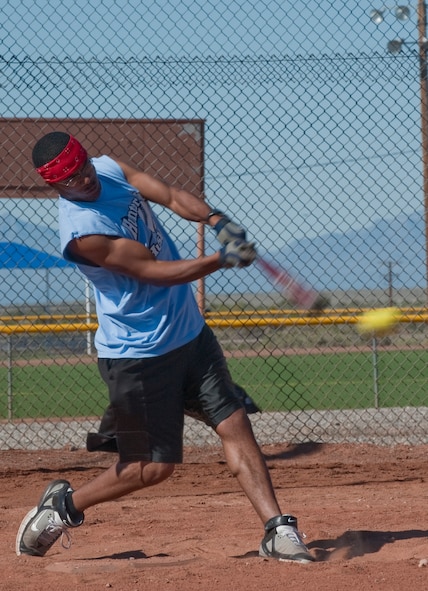 HOLLOMAN AIR FORCE BASE, N.M. -- Airman 1st Class Brandon Jones, 49th Logistics Readiness Squadron, hits a baseball during the homerun derby on Sports Day Sept. 17, 2010. Sports Day is an annual event held by the Domenici Fitness and Sports Center, which allows personnel from different squadrons to compete against one another for awards and trophies. (U.S. Air Force photo by Airman 1st Class Joshua Turner / Released)