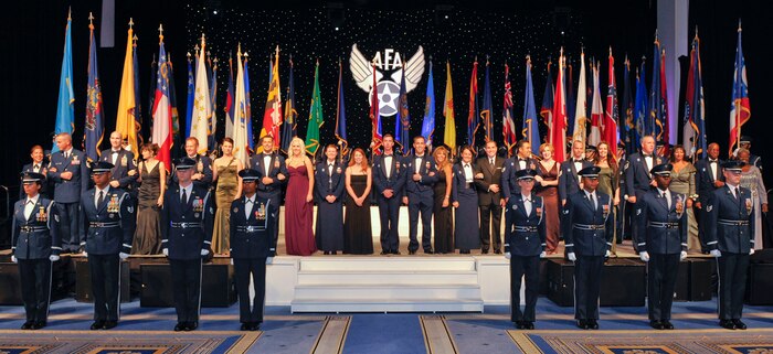 The Air Force's 12 Outstanding Airmen of the Year are introduced at the Air Force Association's dinner honoring them Sept. 13, 2010, in National Harbor at Oxon Hill, Md. Joining the group as one of the 12 was Senior Airman Samuel Siewert from Joint Base Charleston. Airman Siewert was selected as Airman of the Year at the base, numbered Air Force and major command-level before his selection for the Air Force-level award in late-July. The dinner was one of many events honoring the Airmen during the AFA's Air and Space Conference and Technology Exposition. Airman Siewert is a driver operator with the 628th Civil Engineer Squadron. (U.S. Air Force photo/Michael J. Pausic)