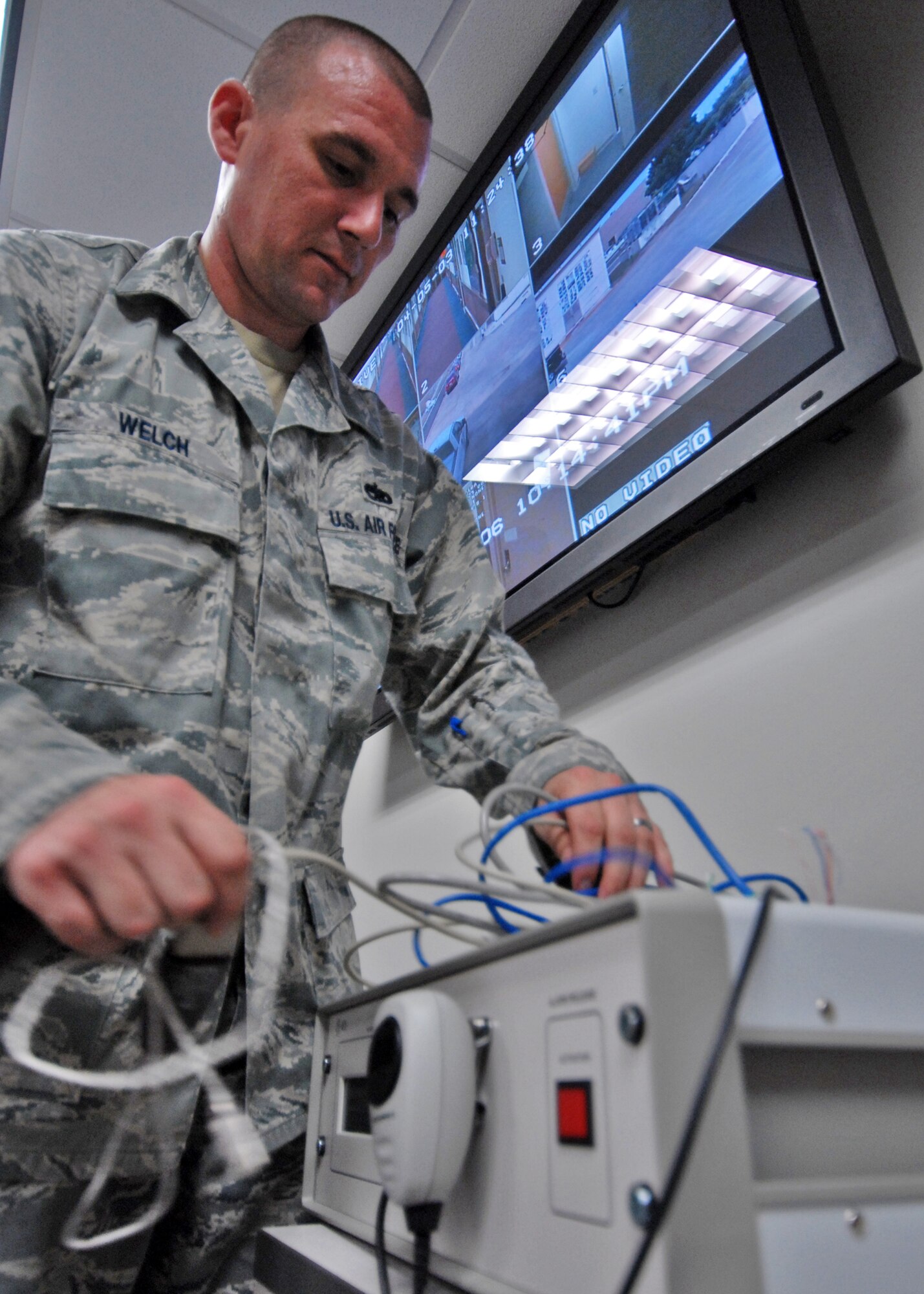 Tech. Sgt. Steve Welch, 96th Communications Squadron, begins to install the command post's giant voice system at their new location in Building 1.  The command post serves as the executive agency for command and control for commanders during routine operations, emergencies, contingencies and increased readiness.  The CP is a 24 hour a day, seven days a week operation that has 17 authorizations to man its shifts.  (U.S. Air Force photo/Samuel King Jr.)