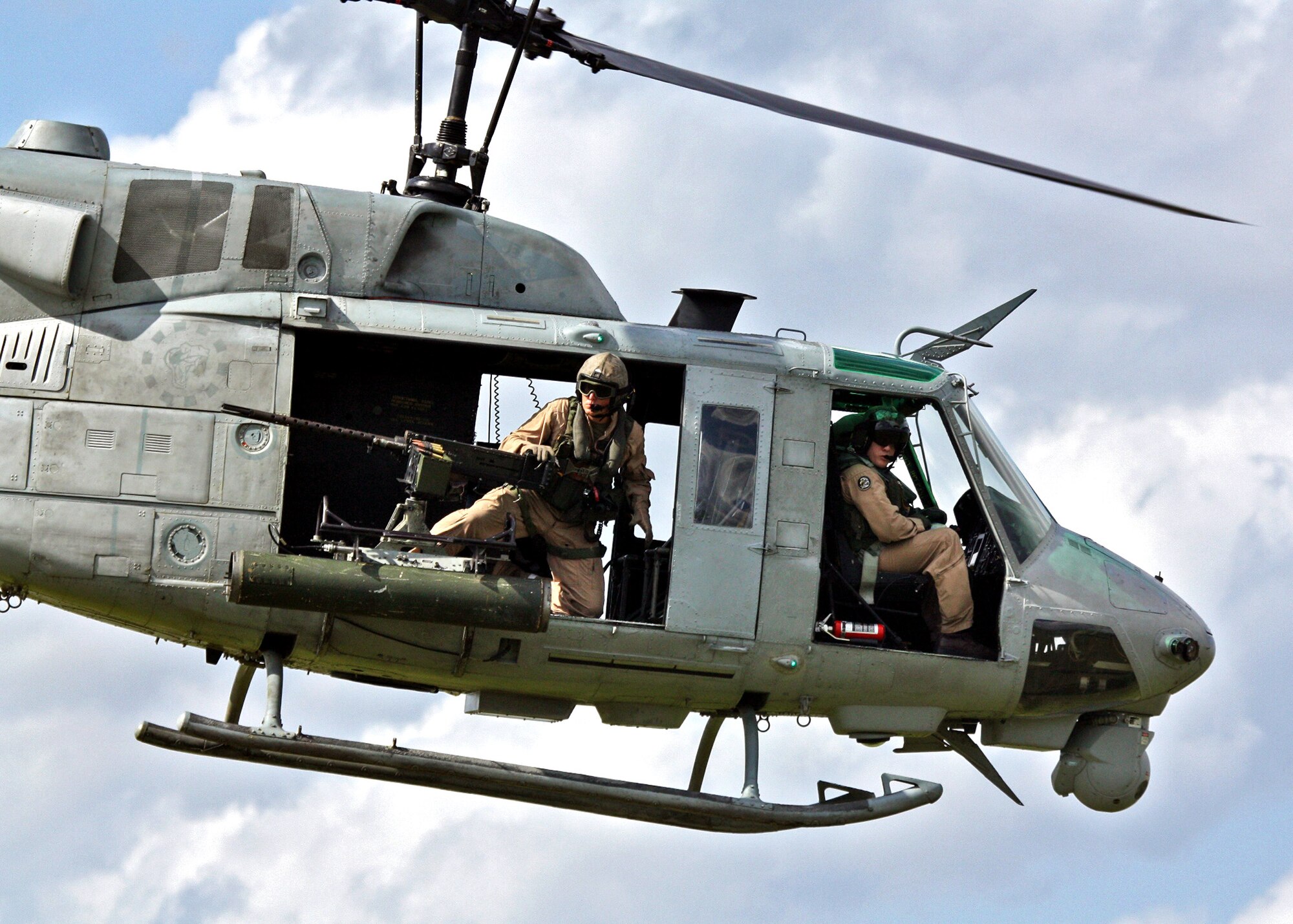 A Marine Corps UH-1 Iroquois helicopter searches for hostile ground targets during exercise Atlantic Strike.  (Photo/ Casey Bain)