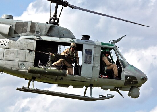 A Marine Corps UH-1 Iroquois helicopter searches for hostile ground targets during exercise Atlantic Strike.  (Photo/ Casey Bain)