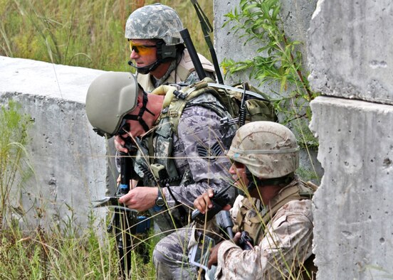 An Air Force Joint Terminal Attack Controller calls for close air support for a Marine maneuver unit during exercise Atlantic Strike 10-02 near Avon Park, Fla. (Photo/ Casey Bain)