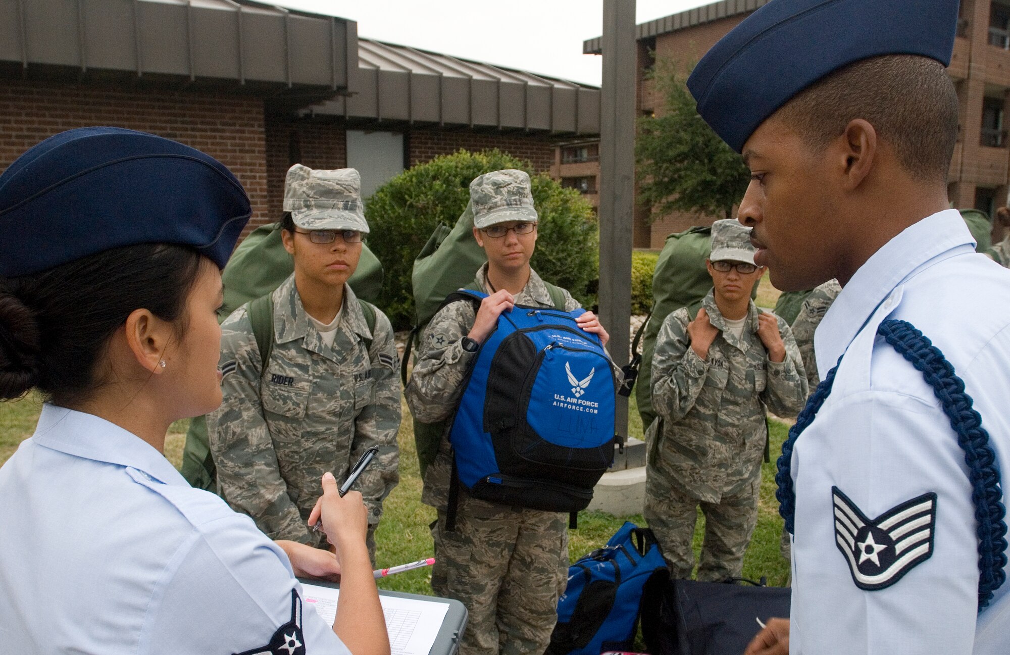 GOODFELLOW AIR FORCE BASE, Texas - Staff Sgt. Derrell Speights, 315th  Training Squadron Military Training Leader and Airman Elspeth Moleno, look over the roster of  Airmen fresh from Basic Military Training at Lackland Air Force Base in San Antonio that have arrived here for  technical training to ensure that everyone makes it to the correct training squadron Sept. 20.  MTL’s are a key part of an Airman’s military training. The Air Education and Training Command Special Duty Team visited Goodfellow Tuesday and spoke about special duty an Air Force Recruiter, Military Training Instructor and Military Training Leader.  Air Force members who may have missed the team’s visit can contact Master Sgt. Kenneth Guise at (325) 654-3589, or stop by building 901 for more information. (U.S. Air Force photo/Master Sgt. Randy Mallard)