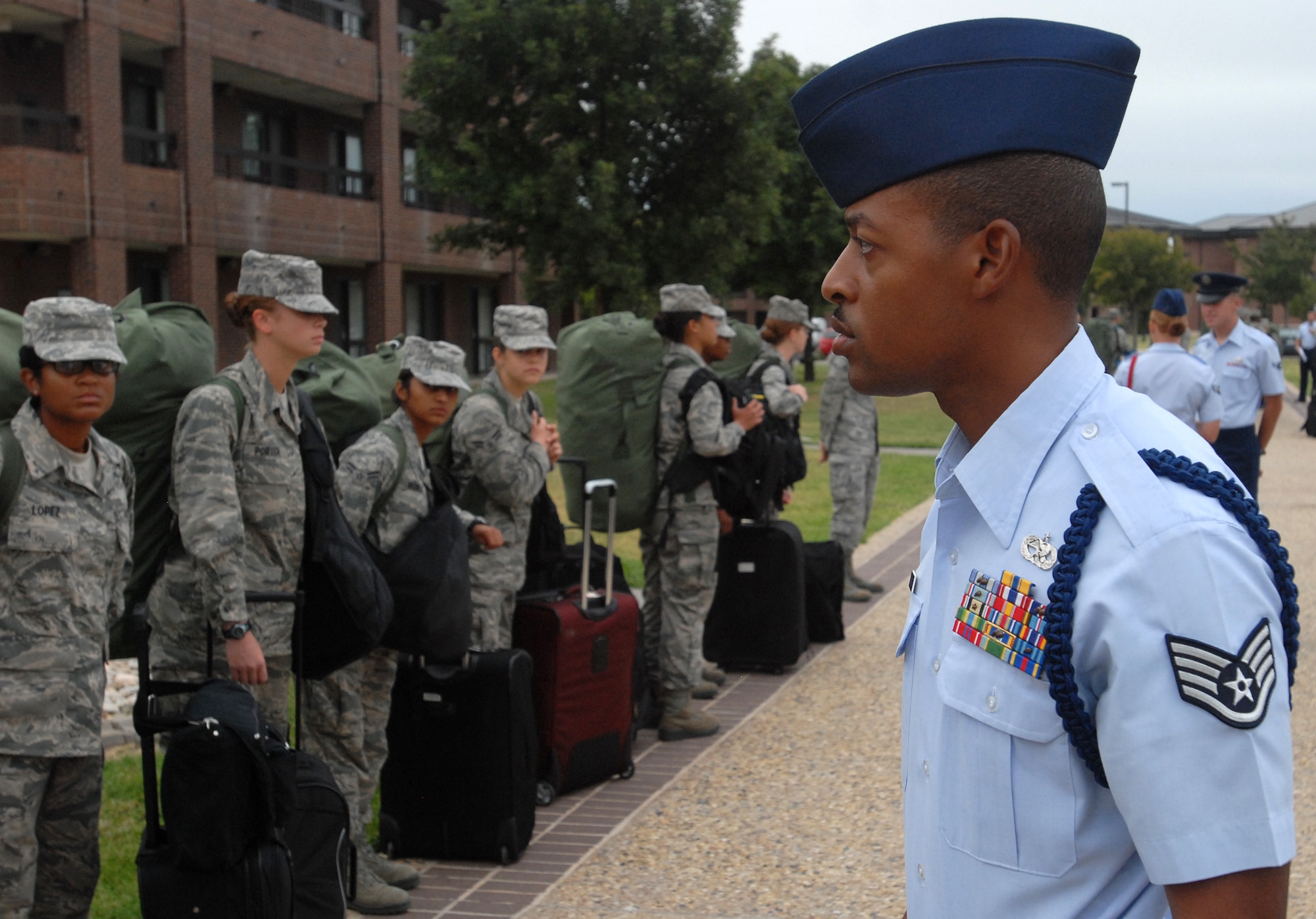 GOODFELLOW AIR FORCE BASE, Texas - Staff Sgt. Derrell Speights, 312th Training Squadron Military Training Leader, looks over a line of Airmen fresh from Basic Military Training at Lackland Air Force Base in San Antonio after their arrival here for technical training Sept 20.  MTL’s are a key part of an Airman’s military training. The Air Education and Training Command Special Duty Team visited Goodfellow Tuesday and spoke about special duty an Air Force Recruiter, Military Training Instructor and Military Training Leader.  Air Force members who may have missed the team’s visit can contact Master Sgt. Kenneth Guise at (325) 654-3589, or stop by building 901 for more information. (U.S. Air Force photo/Master Sgt. Randy Mallard)