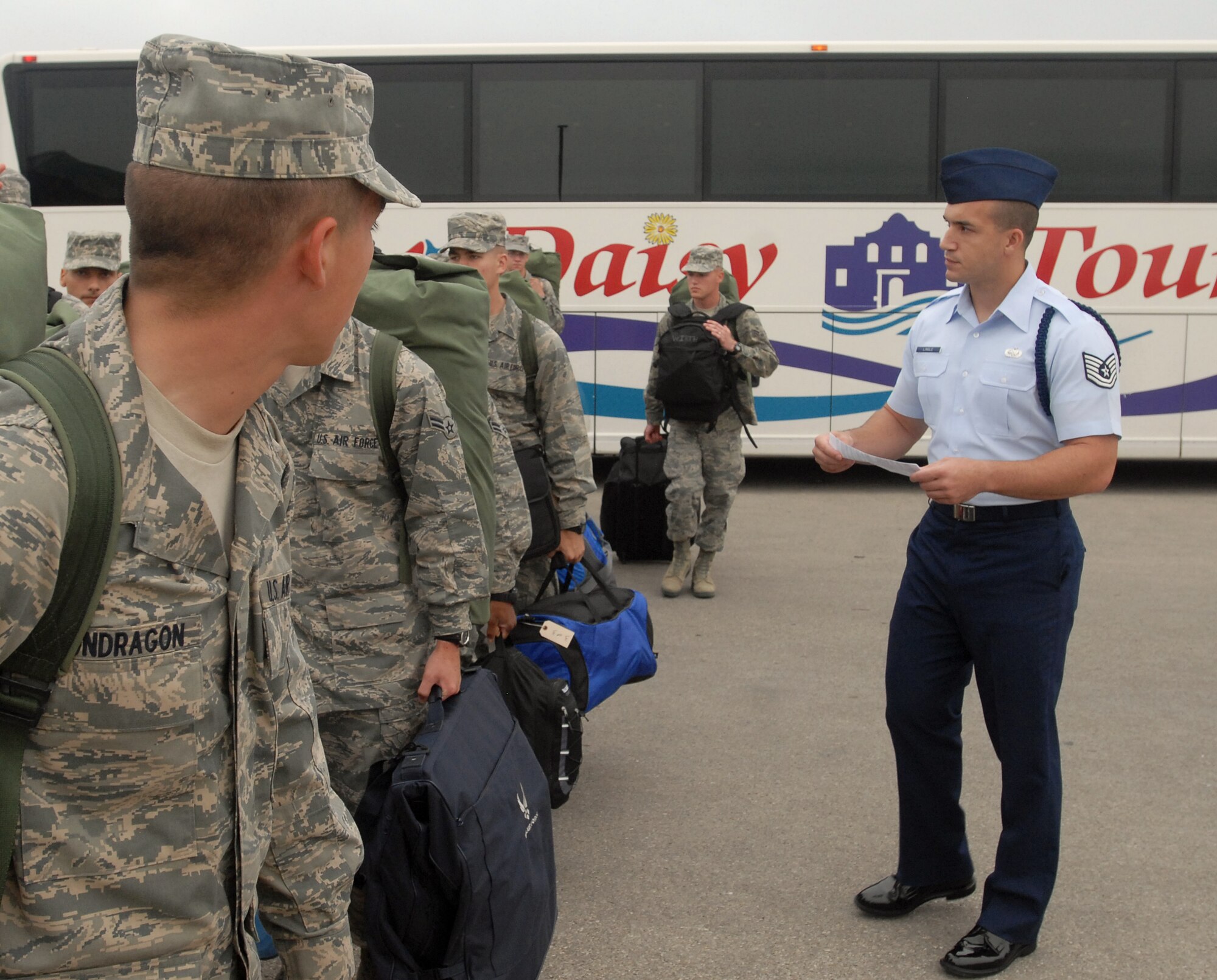 GOODFELLOW AIR FORCE BASE, Texas - Tech. Sgt. Richard Lingle, 312th Training Squadron Military Training Leader, waits for Airmen fresh from Basic Military Training at Lackland Air Force Base in San Antonio to disembark from a bus after arriving at here for technical training Sept. 20.  MTL’s are a key part of an Airman’s military training. The Air Education and Training Command Special Duty Team visited Goodfellow Tuesday and spoke about special duty an Air Force Recruiter, Military Training Instructor and Military Training Leader.  Air Force members who may have missed the team’s visit can contact Master Sgt. Kenneth Guise at (325) 654-3589, or stop by building 901 for more information. (U.S. Air Force photo/Master Sgt. Randy Mallard)