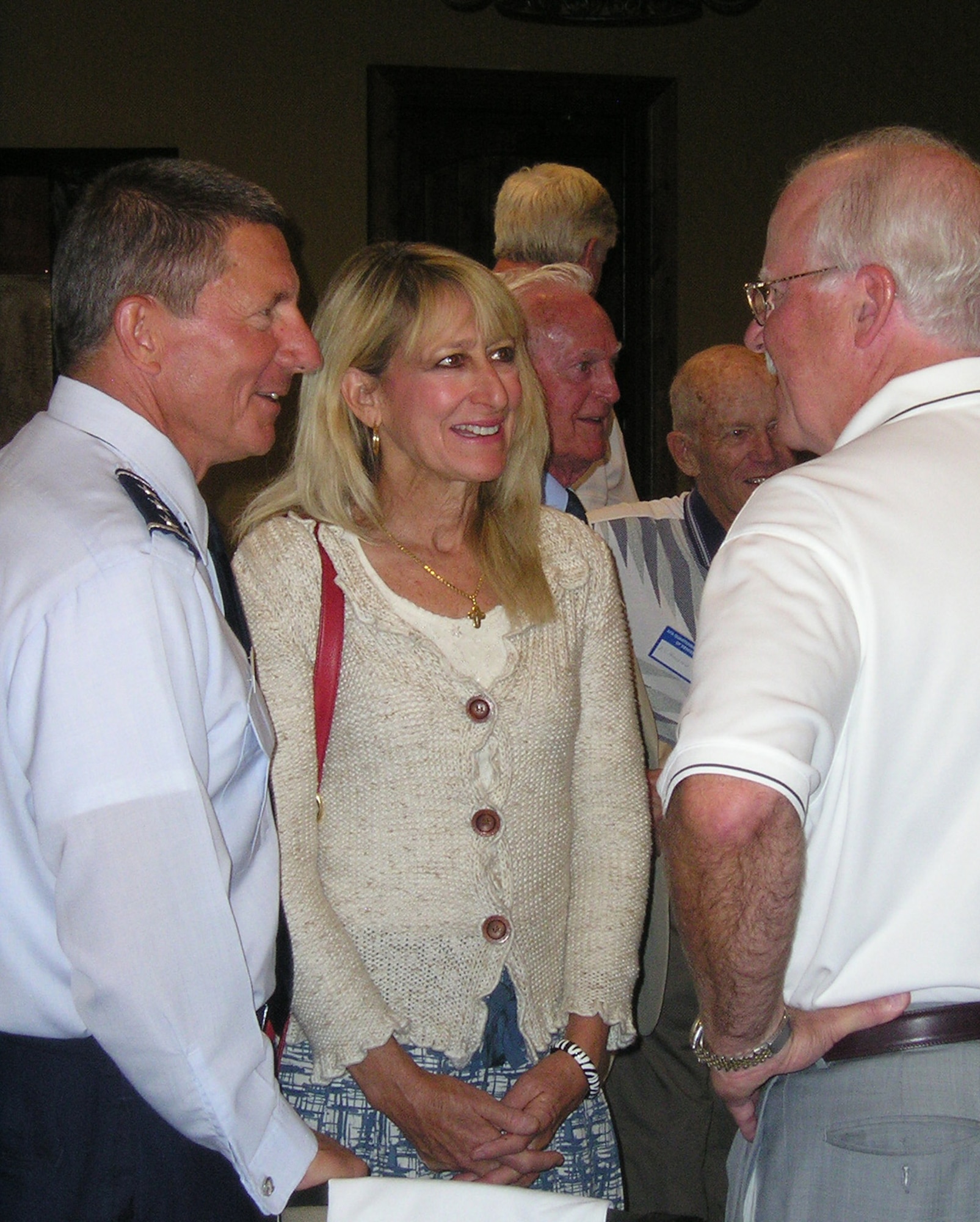 Lt. Gen. Mike Gould and his wife, Paula, talk to a member of the Denver Quarterback Club in Parker, Colo., Sept. 9. General Gould, the Air Force Academy superintendent, informed audience members of the Academy's athletics programs as well as how cadet-athletes interact with the local community. (U.S. Air Force photo/David Edwards)