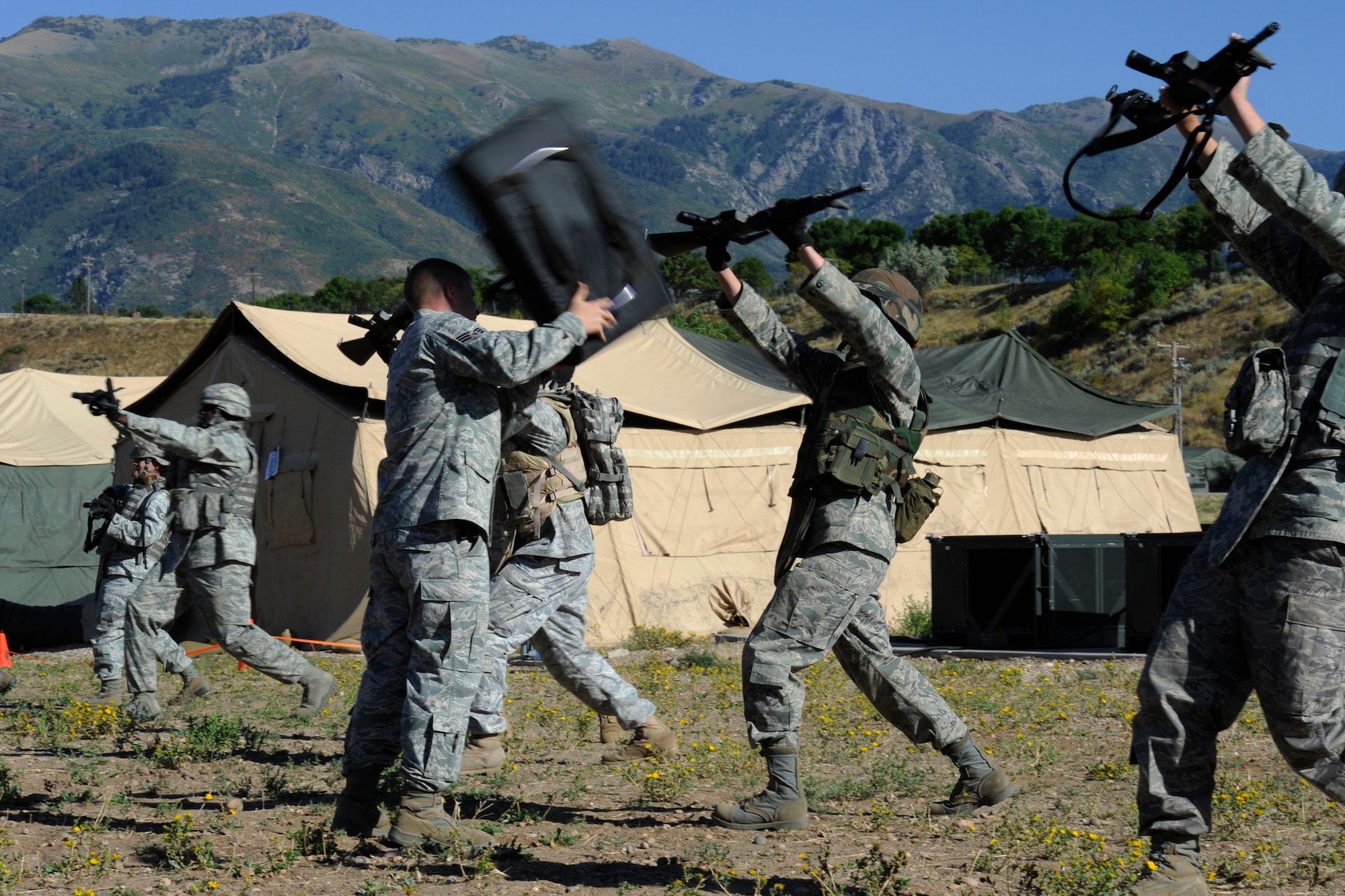 Senior Airman Stephany Miller, a combat photographer with the 2d Combat Camera Squadron, practices rifle fighting techniques while attending the 75th Security Forces Combat Readiness Training course at Hill Air Force Base, Utah on Sept. 13, 2010. The CRT course is used to provide airman with the basic skills needed to deploy to include tactical movements, land navigation, and self aid buddy care. (U.S. Air Force photo by Staff Sgt. Renae Saylock)