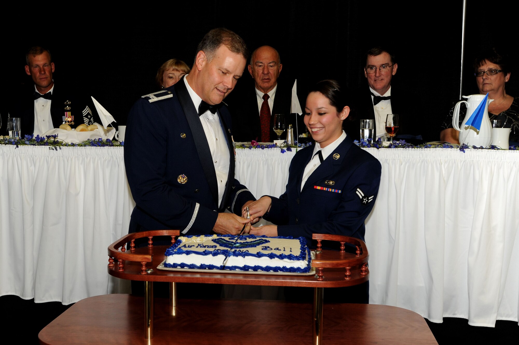 Col. Don Shaffer, 319th Air Refueling Wing commander, cuts the cake with Airman 1st Class Jessica Elam, 319th Logistics Readiness Squadron, during the Grand Forks Air Force Base Air Force Ball Sept. 17 at the Ralph Englestad Arena in Grand Forks, N.D. The United States Air Force ended a 40-year association with the United States Army when President Harry S. Truman signed the National Security Act of 1947; Sept. 18, 2010, marked the 63rd Anniversary of the U.S. Air Force. (U.S. Air Force photo by Staff Sgt. Suellyn Nuckolls)
