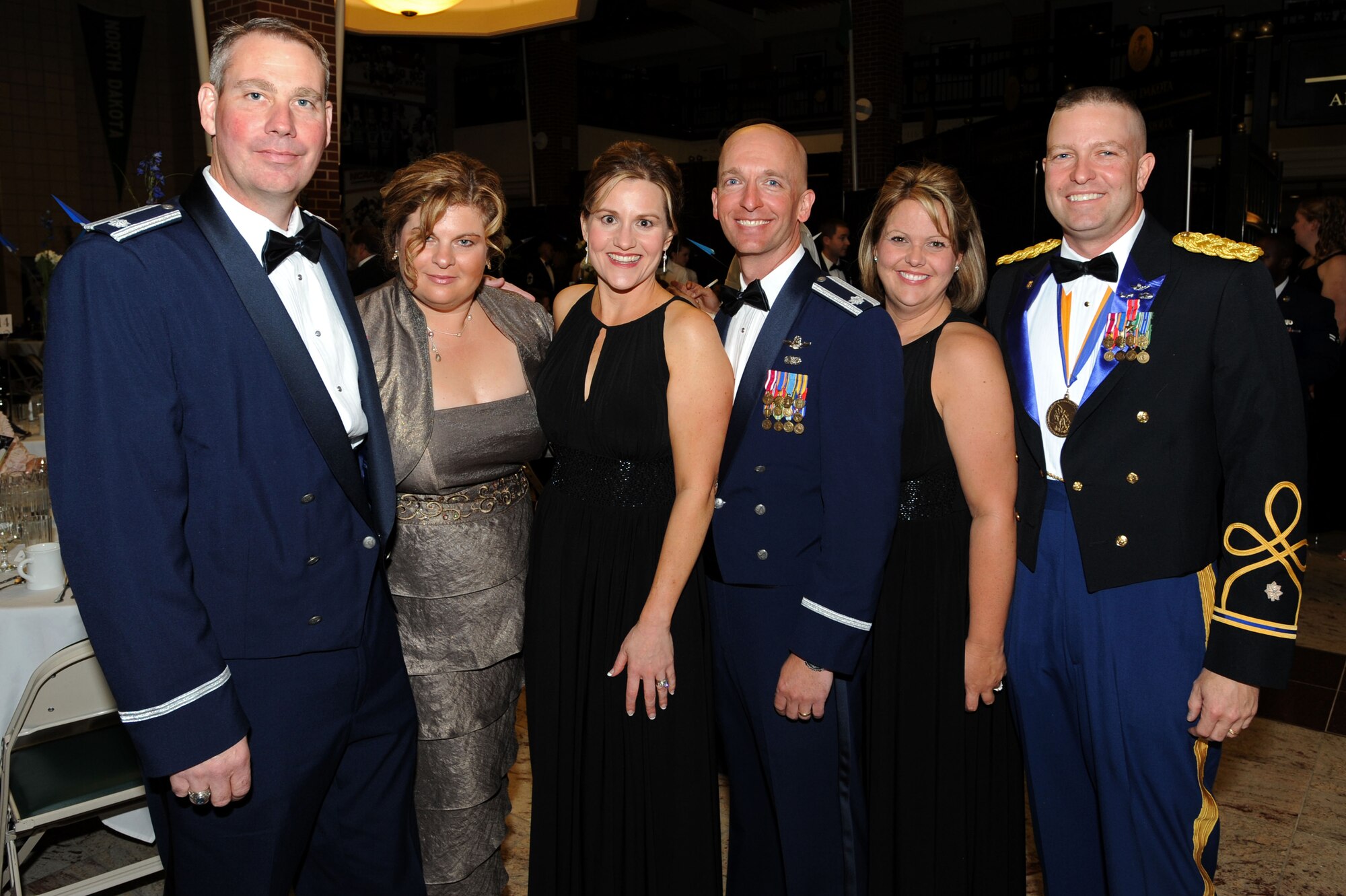 From left to right, Lt. Col. David Beaver, 905th Air Refueling Squadron, Pam Beaver, Christine Bradford, Lt. Col. Noel Bradford, 905th Air Refueling Squadron commander, Amy Sauls and Army Lt. Col. Josh Saul, University of North Dakota Army ROTC commander, pose for a photo during the Grand Forks Air Force Base Air Force Ball Sept. 17 at the Ralph Englestad Arena in Grand Forks, N.D. The United States Air Force ended a 40-year association with the United States Army when President Harry S. Truman signed the National Security Act of 1947; Sept. 18, 2010, marked the 63rd Anniversary of the U.S. Air Force. (U.S. Air Force photo by Staff Sgt. Suellyn Nuckolls)