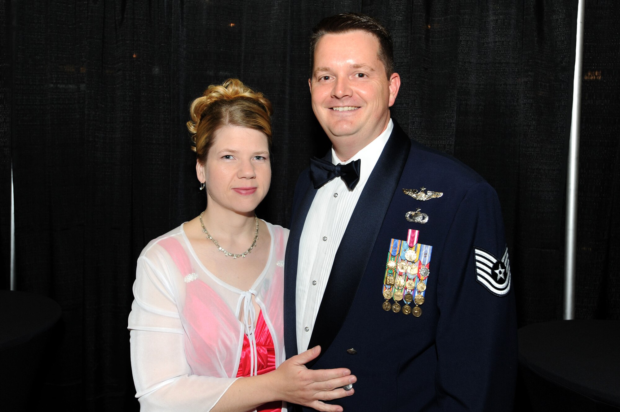 Tech. Sgt. Joseph Kapinos, 319th Air Refueling Wing Public Affairs, and his wife, Tanja Kapinos, pose for a photo during the Grand Forks Air Force Base Air Force Ball Sept. 17 at the Ralph Englestad Arena in Grand Forks, N.D. The United States Air Force ended a 40-year association with the United States Army when President Harry S. Truman signed the National Security Act of 1947; 2010 marked the 63rd Anniversary of the U.S. Air Force. (U.S. Air Force photo by Staff Sgt. Suellyn Nuckolls)