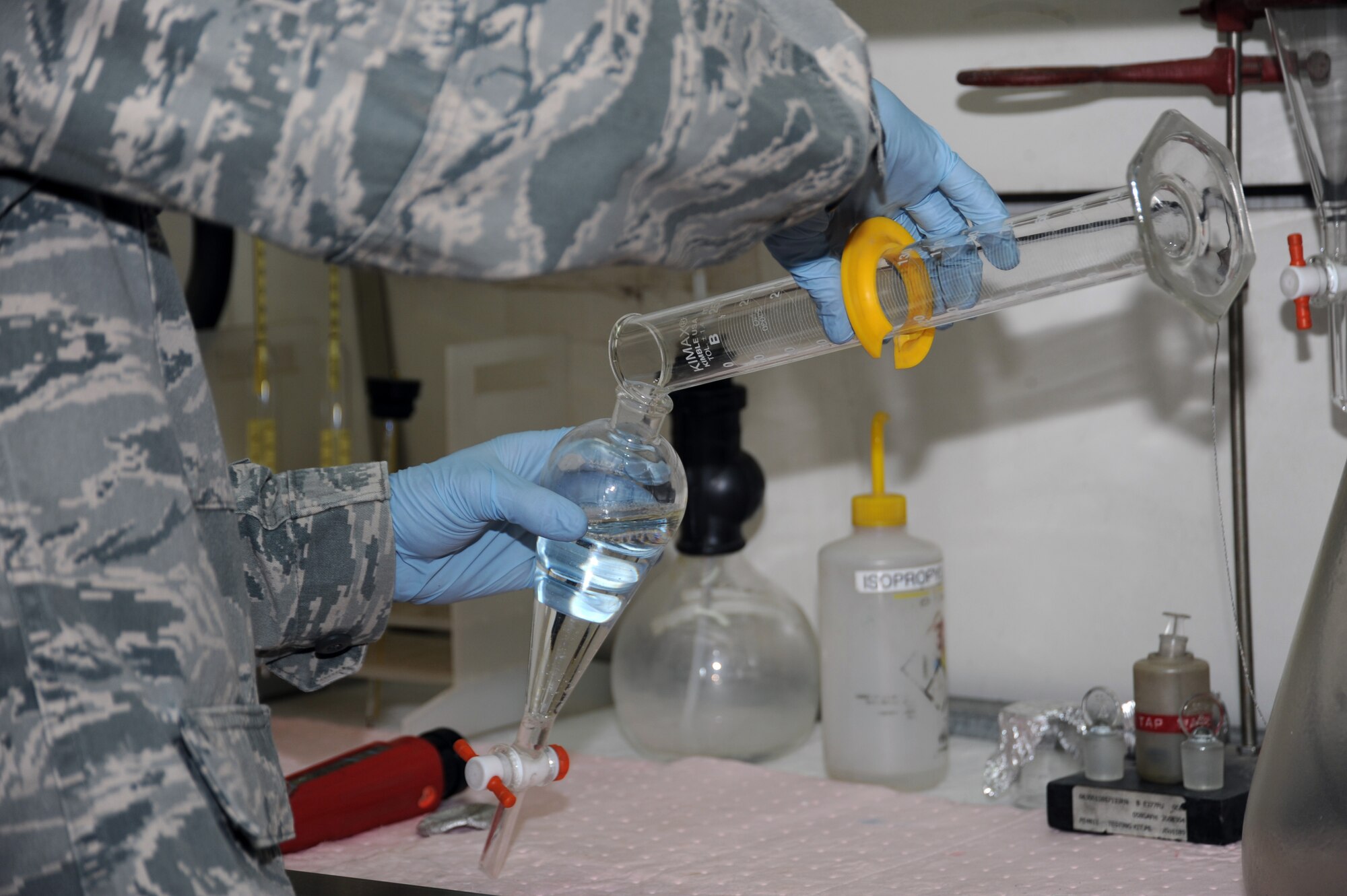 Staff Sgt. Matthew Nichols, 380th Expeditionary Logistics Readiness Squadron fuels laboratory NCO in charge, prepares a fuel sample for testing Aug. 26, 2010, at an undisclosed location in Southwest Asia. (U.S. Air Force photo/Tech. Sgt. April Wickes)