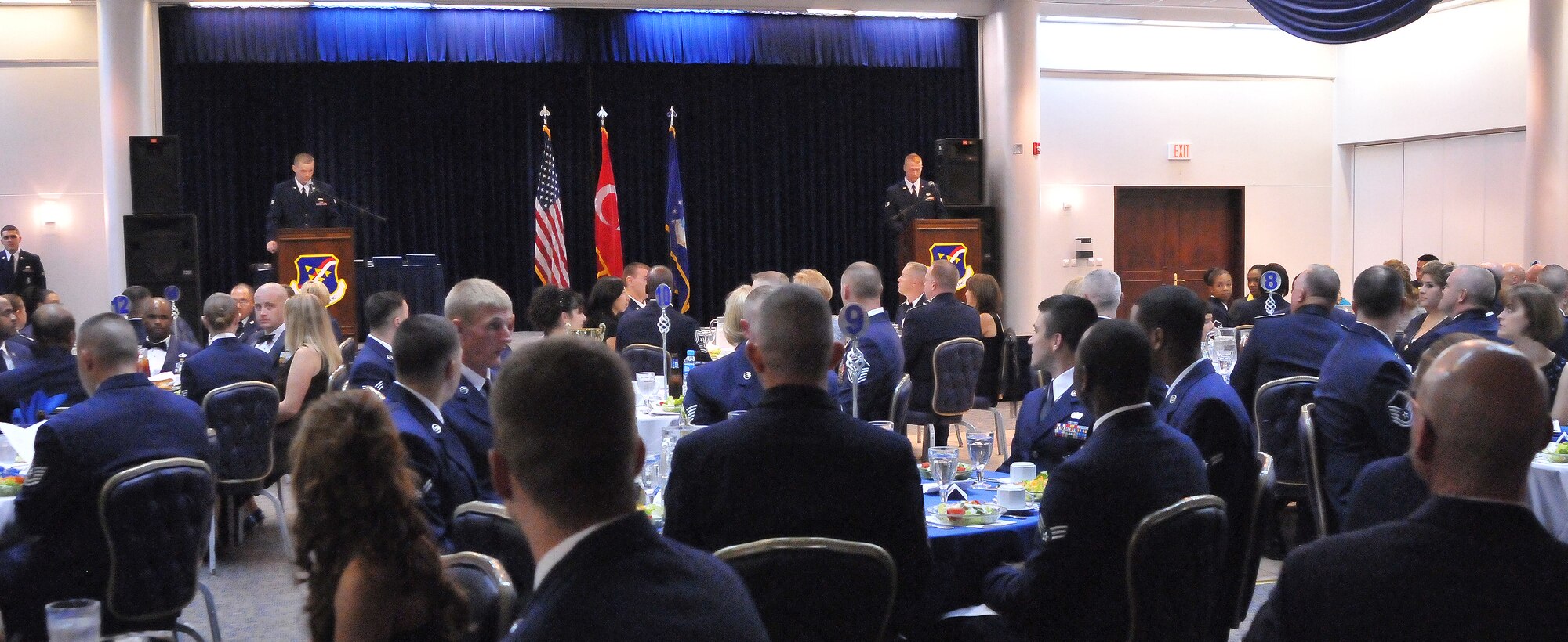 Senior Airman Brendan Victory, 39th Logistics readiness Squadron, and Senior Airman Aaron Johnson, 39th Air Base Wing Public Affairs, are the masters of ceremony during the Airman Leadership School graduation at the consolidated club Sept. 17, 2010 at Incirlik Air Base, Turkey.  ALS is a U.S. Air Force professional military education program designed to develop Airmen into effective front-line supervisors. (U.S. Air Force photo by Senior Airman Alexandre Montes/Released)