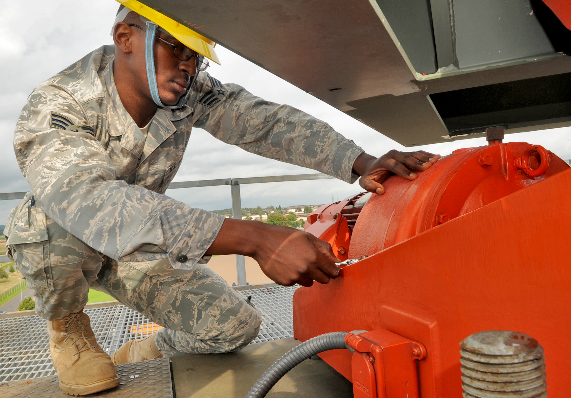 SPANGDAHLEM AIR BASE, Germany -Senior Airman Michael Williams, 52nd Communications Squadron ground radar systems journeyman, loosens a cap to check oil on a radar system Sept. 9. Radar maintainers follow a set of technical orders focusing specifically on maintenance tasks, procedures and intervals for preventative maintenance inspections which include 79 separate items to certify the radar systems are functioning properly. (U.S. Air Force photo/Airman 1st Class Nick Wilson)