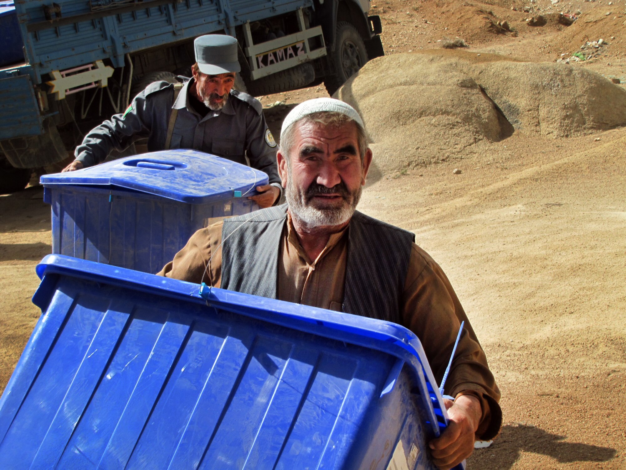 100920-F-878I-002 KABUL, Afghanistan - Afghan residents of the regions west of Ghazni work to load election ballots onboard Afghan Air Force Mi-17 helicopters on Sep. 20, 2010. The AAF worked long days in order to disseminate ballots to all regions of Afghanistan. These efforts lead to a 40 percent turnout by Afghan citizens. (US Air Force photo by Technical Sergeant Tony Iusi/ RELEASED).