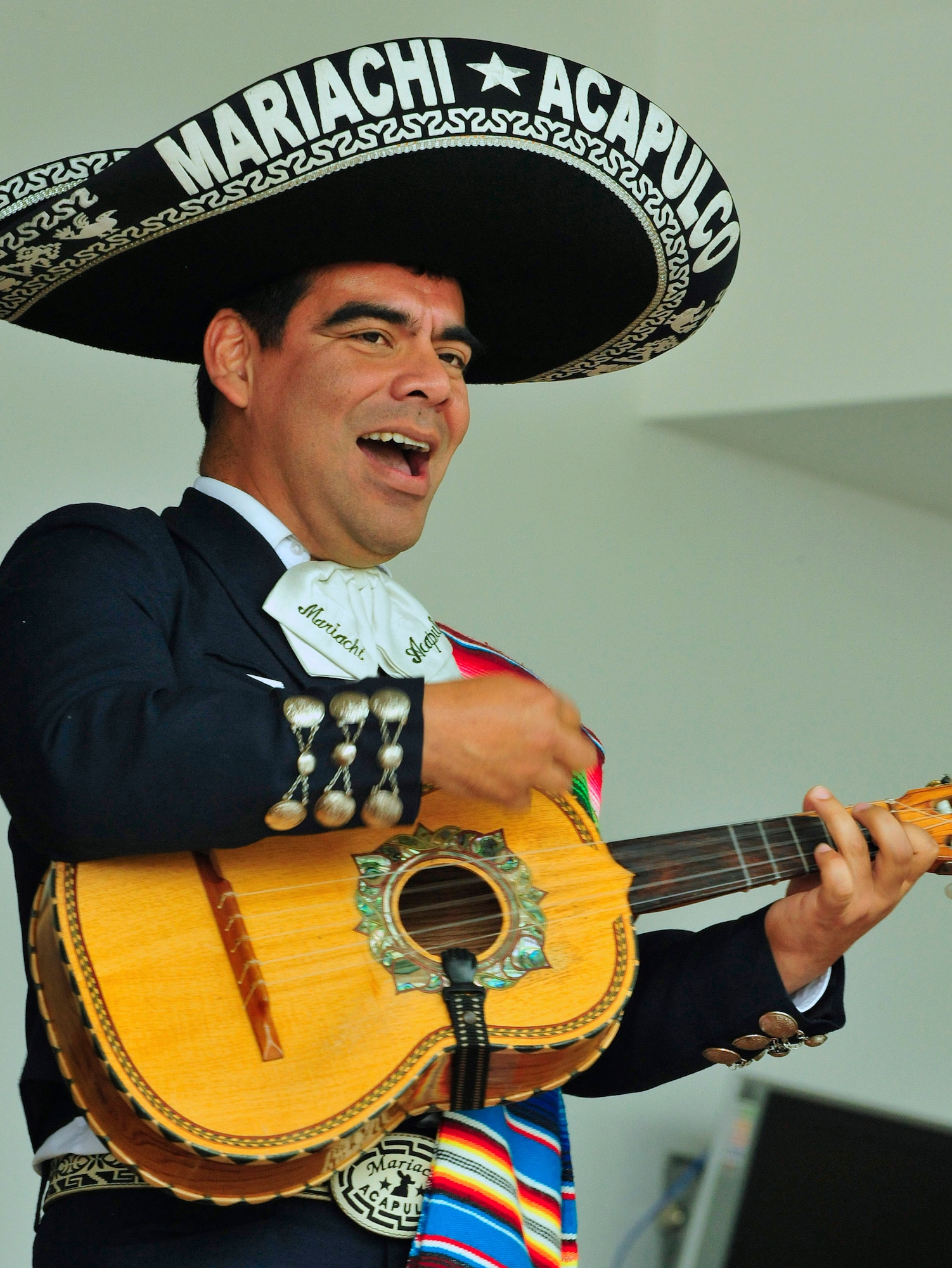 Marco Antonio, guitar player and singer for the band Mariachi Acapulco, performs traditional hispanic songs during the Hispanic Heritage month kickoff event held at the Kaiserslautern Military Community Center, Ramstein Air Base, Germany, Sept. 18, 2010. Hispanic Heritage month events celebrate heritage, diversity, integrity and honor and take place from Sept. 15 through Oct. 15 this year. (U.S. Air Force photo by Staff Sgt. Stephen J. Otero)