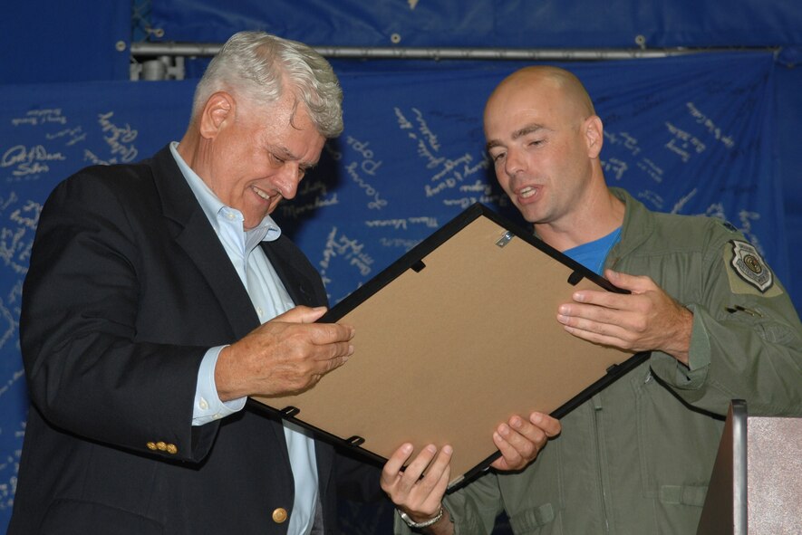 SEYMOUR JOHNSON AIR FORCE BASE, N.C. – Lt. Col. Michael Webb presents a token of appreciation to retired Brig. Gen. Lawrence Huggins for taking the time to speak during the 4th Fighter Wing and 334th Fighter Squadron 70th anniversary celebration here Sept. 17, 2010. Colonel Webb is the commander of the 334 Fighter Squadron. General Huggins is a former 334th Tactical Fighter Squadron commander.  (U.S. Air Force photo/Tech. Sgt. Tammie Moore)