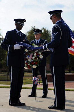 SEYMOUR JOHNSON AIR FORCE BASE, N.C. – Members of the 4th Fighter Wing Honor Guard fold an American flag during a POW/MIA Recognition Ceremony here Sept. 17, 2010. National POW/MIA Recognition Day is observed each year on the third Friday of September to honor the sacrifices made by POWs and those who are still MIA. (U.S. Air Force photo/ Senior Airman Mackenzie Lang)