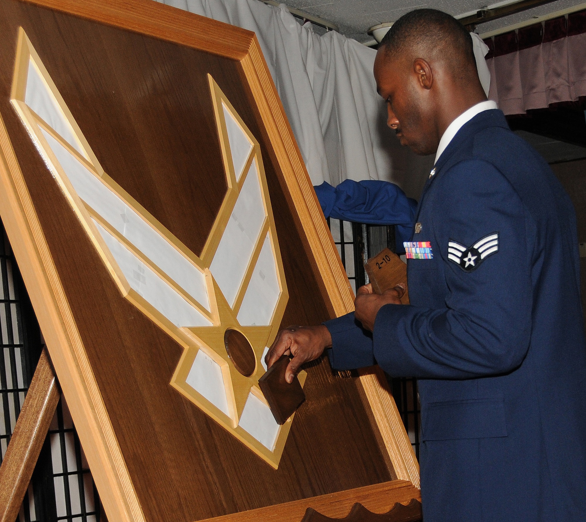 Kadena Airmen paid tribute to the Air Force's 63rd birthday by reciting the Airman's Creed and the symbolism of each section within the Air Force logo at the Kadena Officer's Club, Sept.18.The 18th Wing celebrated the Air Force's 63rd birthday in unprecedented fashion by hosting two events simultaneously at the Rocker Non-Commissioned Officer's Club and the Officer's Club.(U.S. Air Force photo/Airman 1st Class Jarvie Z. Wallace)