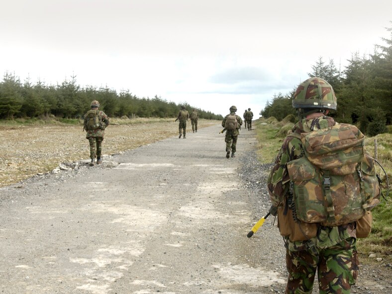 Royal Air Force Regiment infantrymen exercise combat scenarios during a training mission at Davidstow, North Cornwall, England. Realistic combat training is necessary to prepare medics for combat operations in Southern Afghanistan. (Royal Air Force Photo by RAF Senior Aircraftman Chris Davidson)