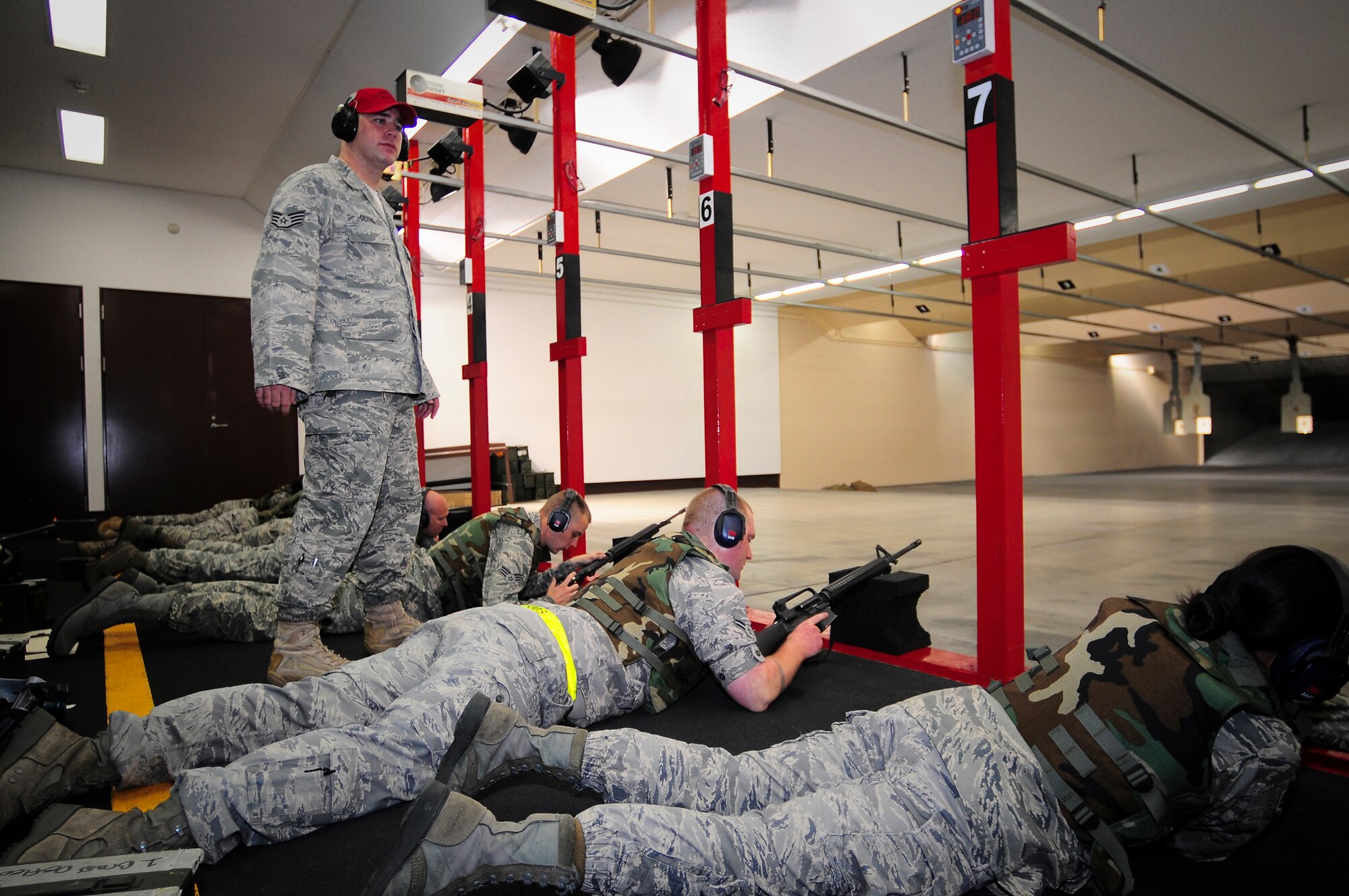 YOKOTA AIR BASE, Japan -- Staff Sgt. John Devine, 374th Security Forces Squadron Combat Arms Instructor, teaches the weapons qualification course here Sept. 20. This class was made up of 16 Yokota Airman, each there to maintain readiness standards for an upcoming deployment. (U.S. Air Force photo by Staff Sgt. Stacy Moless) 