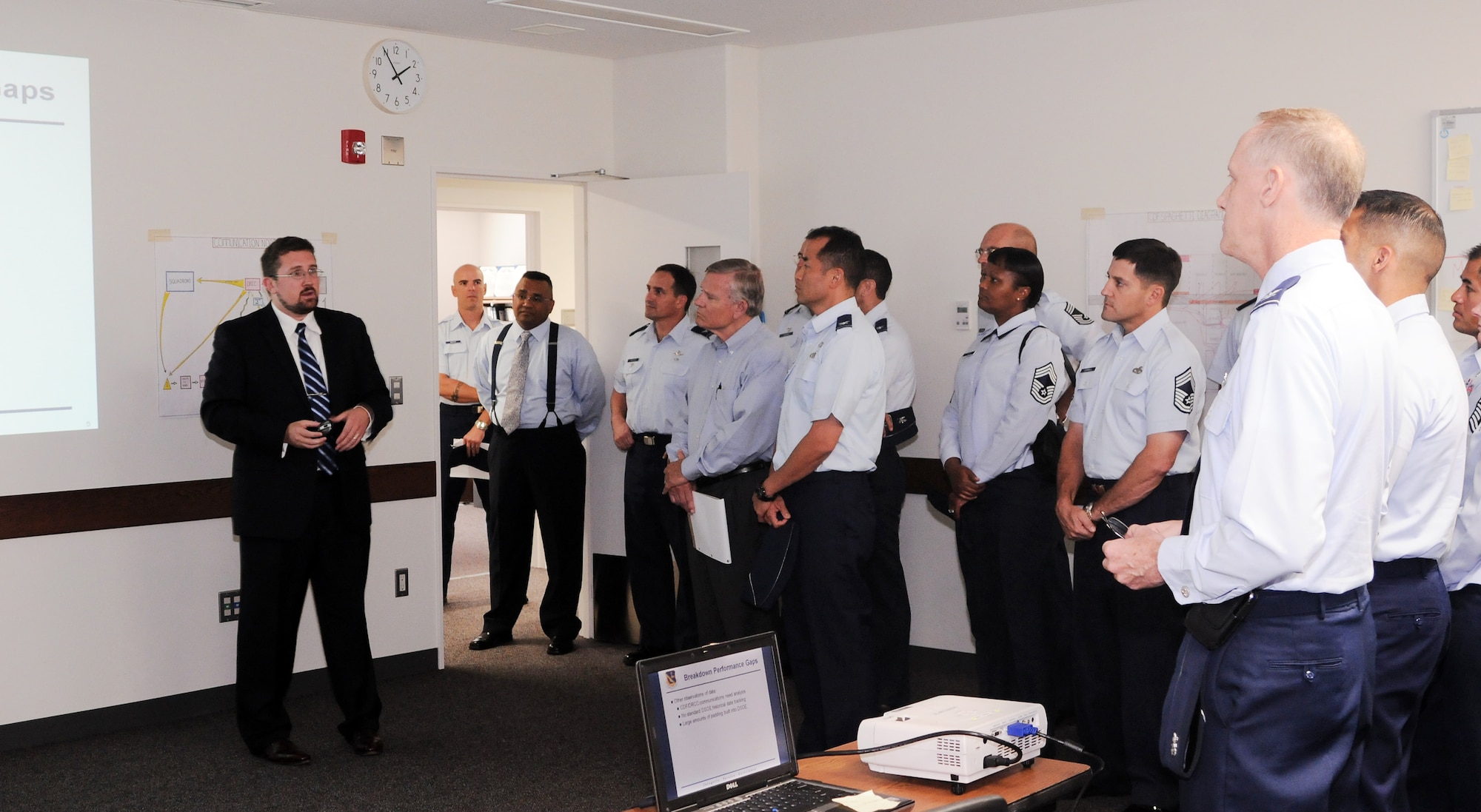 YOKOTA AIR BASE, Japan -- Mr. Jon Albaugh, 374th Airlift Wing Air Force Smart Operations for the 21st Century director, presents to leadership from both Kadena and Yokota Air Bases during the senior leader’s course for AFSO21, here September 20. Together with AFSO21, the base leadership discussed changes need to make cargo deployment operations more efficient. (U.S. Air Force Photo/ Airman 1st Class Katrina R. Menchaca)