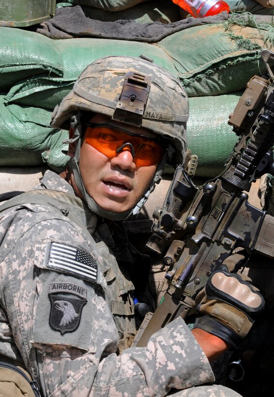 U.S. Army Sgt. Ricardo E. Maya relays information to his fellow soldiers during a firefight at the Shege East Afghan National Police Checkpoint in Kunar province, Afghanistan, Sept. 18, 2010. Maya is assigned to the 327th Infantry Regiment's Company D, 1st Battalion, Task Force Bulldog.