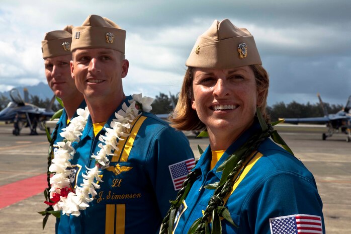 From left to right, Lt. Ben Walborn, Lt. C.J. Simonsen and Lt. Cmdr. Amy Tomlinson, pilots with the U.S. Navy’s Flight Demonstration Squadron, the Blue Angels, are greeted with an aloha following their arrival at the Marine Corps Air Station Kaneohe Bay flight line on Marine Corps Base Hawaii, Sept. 21, 2010. The squadron, comprised of eight F/A-18 Hornet fighter jets and “Fat Albert Airlines,” their C-130 Hercules transport aircraft, is slated to perform during the Kaneohe Bay Airshow here Sept. 25 to 26.