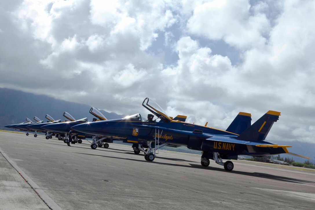 F/A-18 Hornet fighter jets assigned to the U.S. Navy’s Flight Demonstration Squadron, the Blue Angels, rest in a perfect row after arriving at the Marine Corps Air Station Kaneohe Bay flight line on Marine Corps Base Hawaii, Sept. 21, 2010. The squadron, comprised of eight F/A-18 Hornet fighter jets and “Fat Albert Airlines,” their C-130 Hercules transport aircraft, is slated to perform during the Kaneohe Bay Airshow here Sept. 25 to 26.