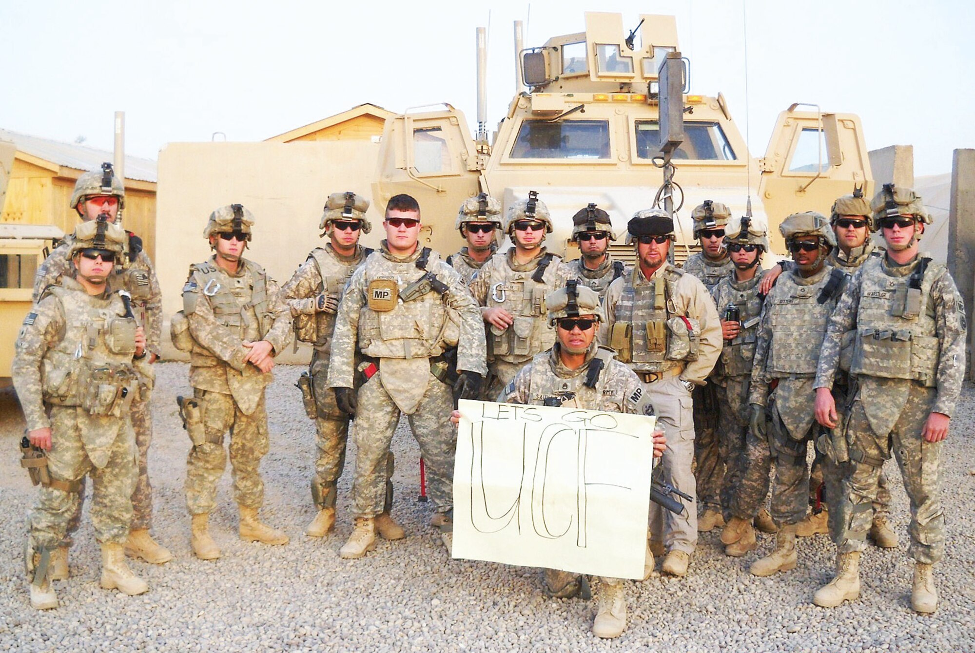 Army Staff Sergeant Eneriko Sauvao sends a message Sept. 6, 2009, to son and University of Central Florida Defensive Tackle Wesley Sauvao, with other members of 545th Military Police Company, 793rd Military Police Battalion, during the unit’s yearlong deployment to Iraq. (Photos courtesy of Staff Sgt. Wesley Sauvao/793rd MP)