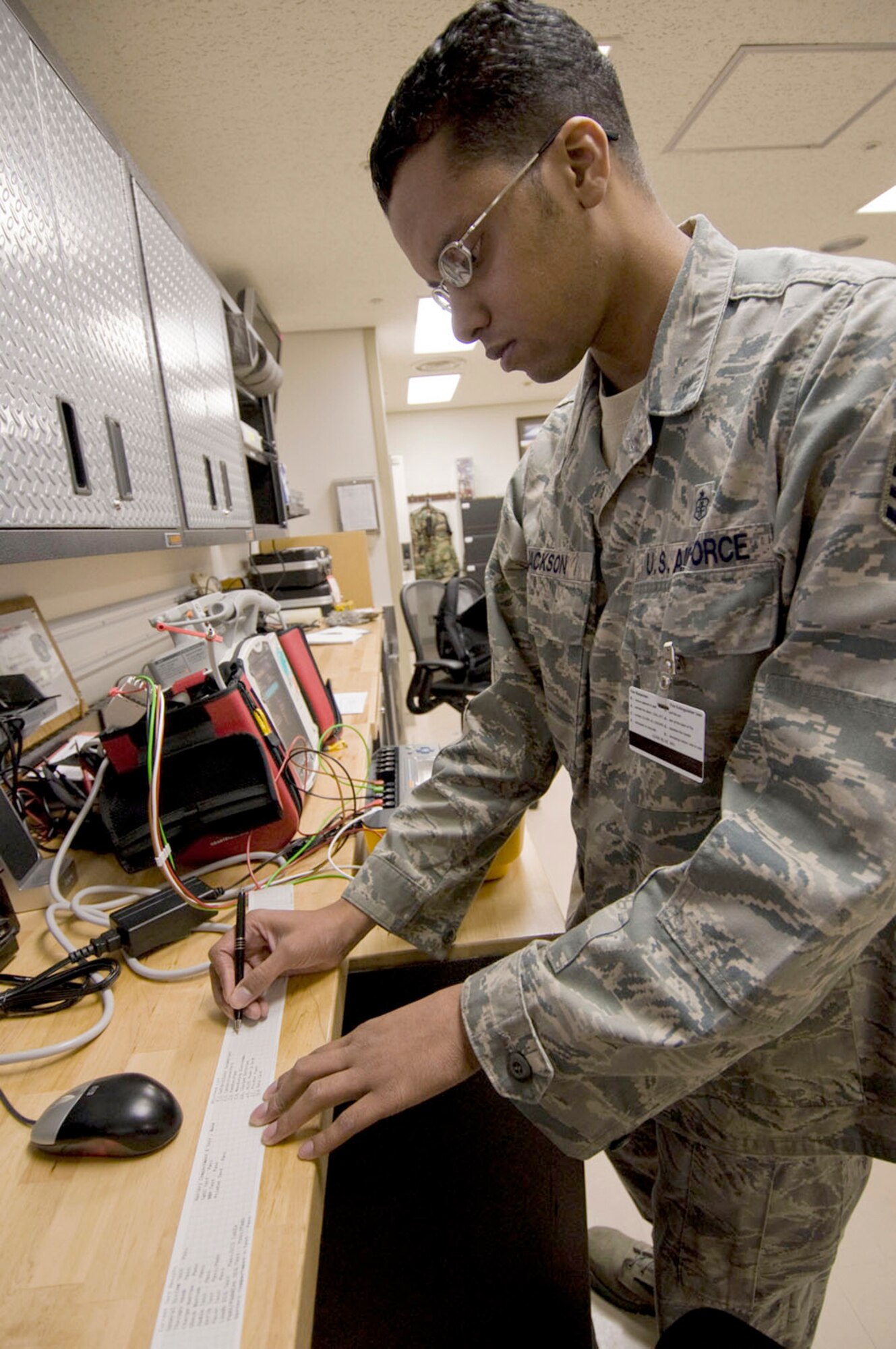Staff Sgt. Hakan Jackson completes an initial inspection of an automatic external defibrillator Sept. 21, 2010, at the hospital at Misawa Air Base, Japan. Sergeant Jackson is a 35th Medical Support Squadron biomedical equipment technician. (U.S. Air Force photo/Senior Airman Jessica Lockoski)