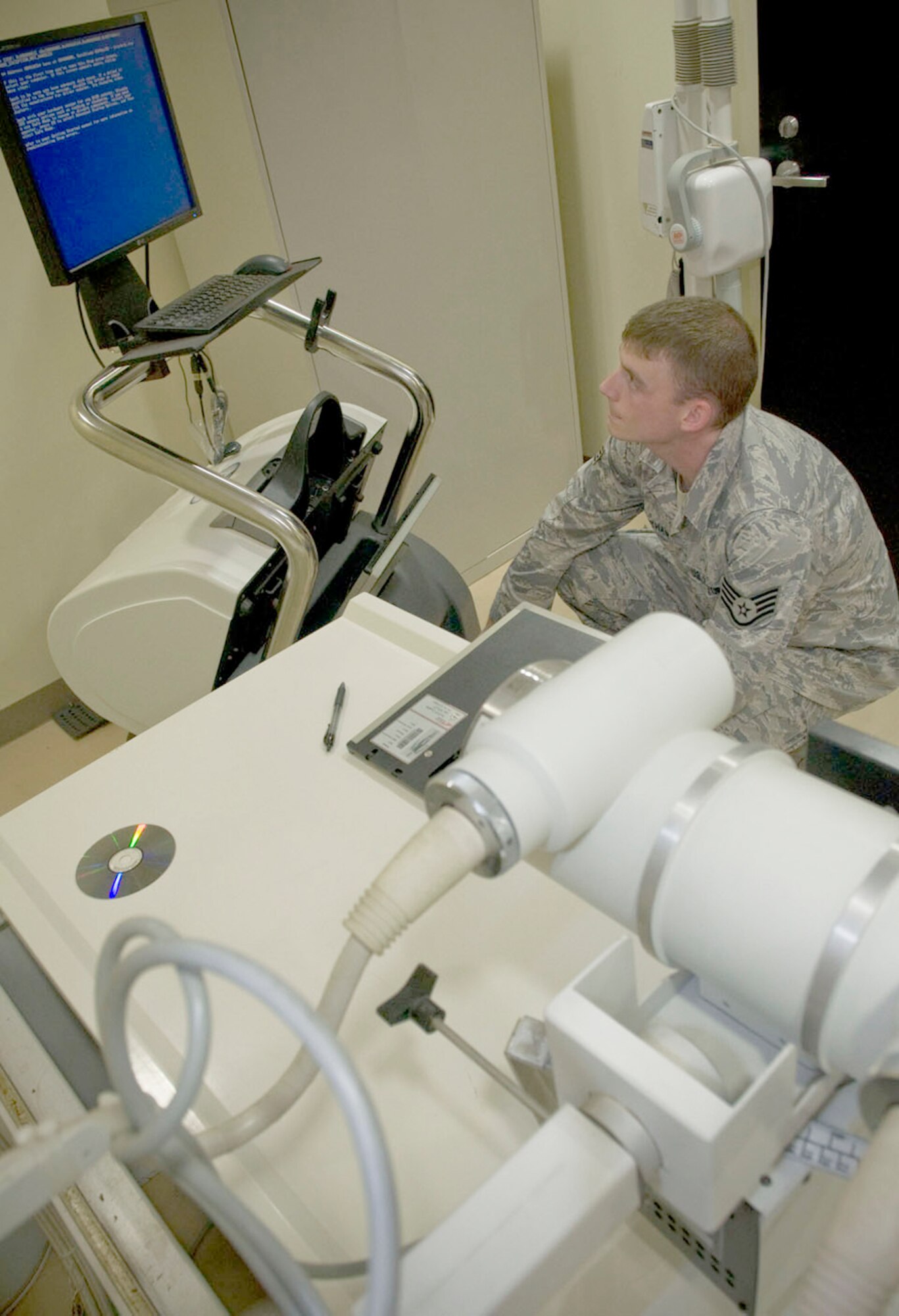 Staff Sgt. Michael Southam reinstalls computer software on an X-ray film digitizer Sept. 21, 2010, at the veterinary clinic at Misawa Air Base, Japan. Sergeant Southam is a 35th Medical Support Squadron biomedical equipment technician. (U.S. Air Force photo/Senior Airman Jessica Lockoski)