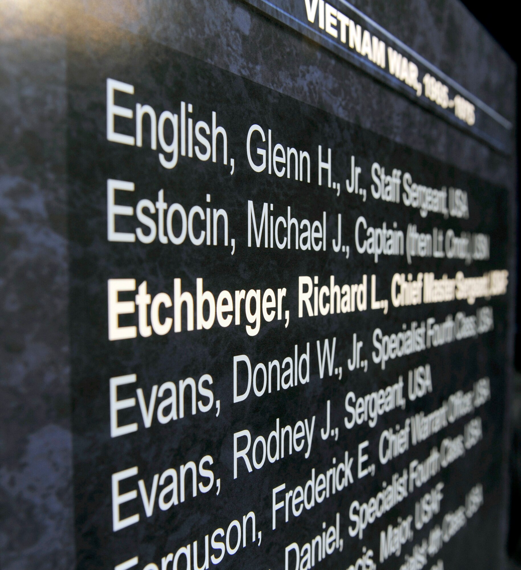 Chief Master Sgt. Richard L. Etchberger's name is added to a Pentagon Hall of Heroes wall panel during an induction ceremony Sept. 22, 2010, in the Pentagon. (U.S. Air Force photo/Andy Morataya)