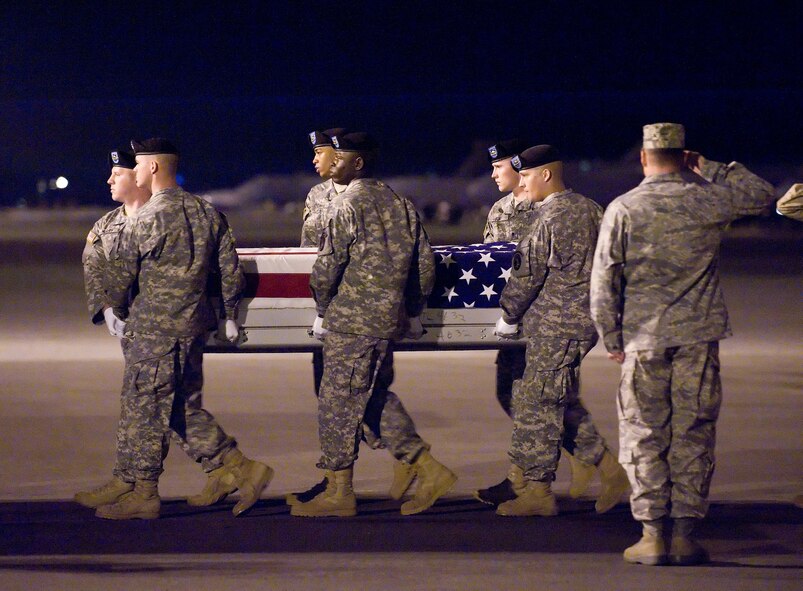 A U.S. Army carry team transfers the remains of Army Pfc. James F. McClamrock of Huntersville, N.C., at Dover Air Force Base, Del., Sept. 9, 2010. McClamrock was assigned to the 1st Battalion, 27th Infantry Regiment, 2nd Stryker Advise and Assist Brigade, 25th Infantry Division, Schofield Barracks, Hawaii. (U.S. Air Force photo/Jason Minto)