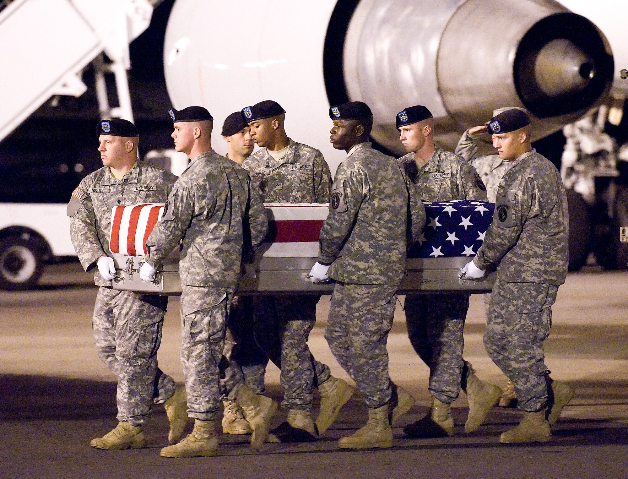 A U.S. Army carry team transfers the remains of Army Sgt. Phillip C. Jenkins of Decatur, Ind., at Dover Air Force Base, Del., Sept. 9, 2010. Jenkins was assigned to the 1st Battalion, 27th Infantry Regiment, 2nd Stryker Advise and Assist Brigade, 25th Infantry Division, Schofield Barracks, Hawaii. (U.S. Air Force photo/Jason Minto)