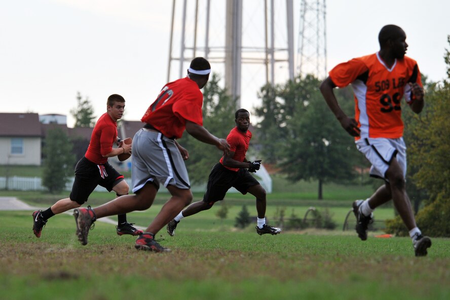 WHITEMAN AIR FORCE BASE, Mo. - Airmen from the 509th Civil Engineer Squadron flag football team face off against the 509th Logistics Readiness Squadron team here Sept. 21. The CES team won with a score of 35-21 over the LRS team. (U.S. Air Force photo/Tech. Sgt. Charles Larkin Sr)