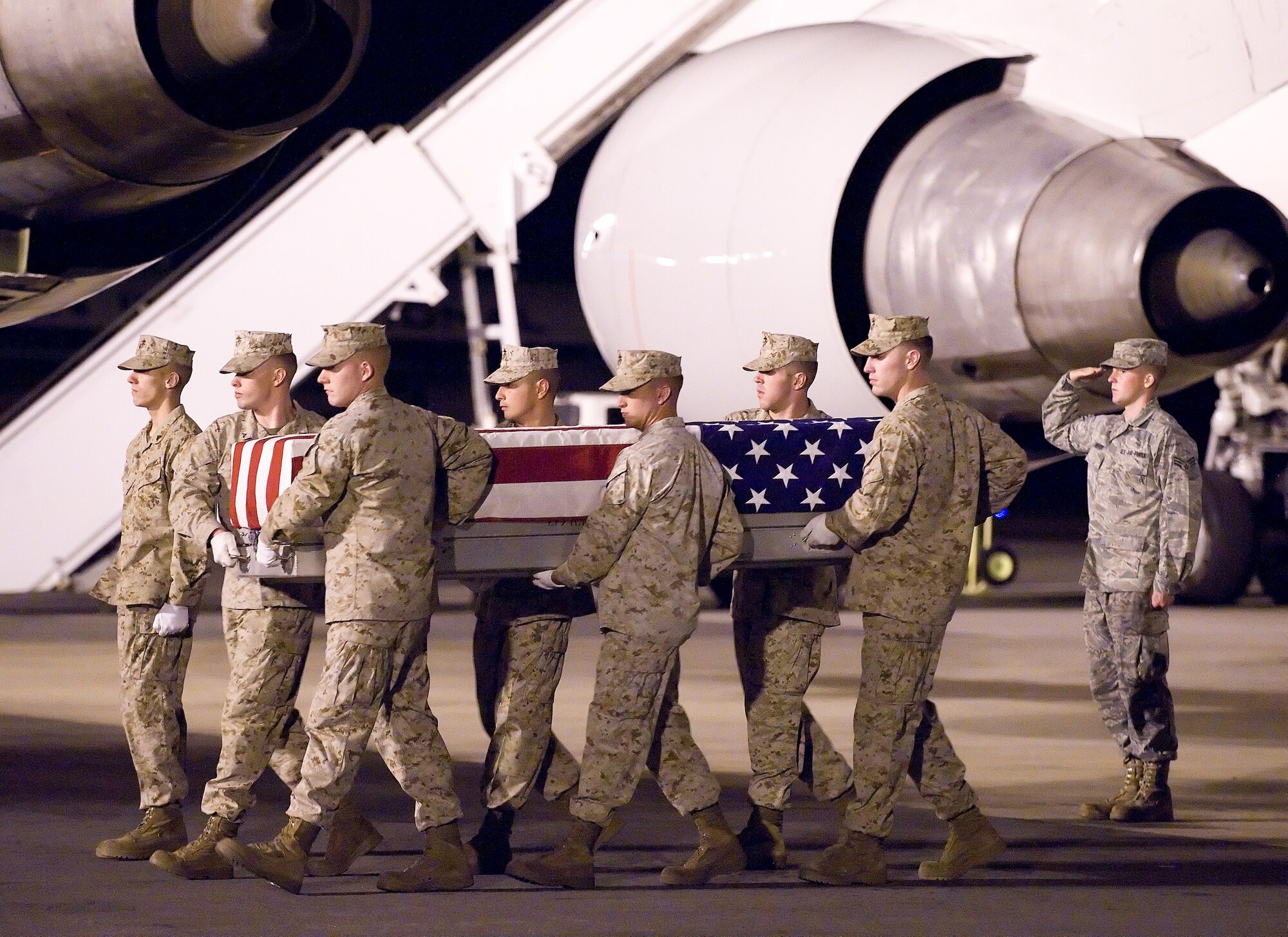 A U.S. Marine Corps carry team transfers the remains of Marine Cpl. John C. Bishop of Columbus, Ind., at Dover Air Force Base, Del., Sept. 9, 2010. Bishop was assigned to the 2nd Battalion, 9th Marine Regiment, 2nd Marine Division, II Marine Expeditionary Force, Camp Lejeune, N.C. (U.S. Air Force photo/Jason Minto)