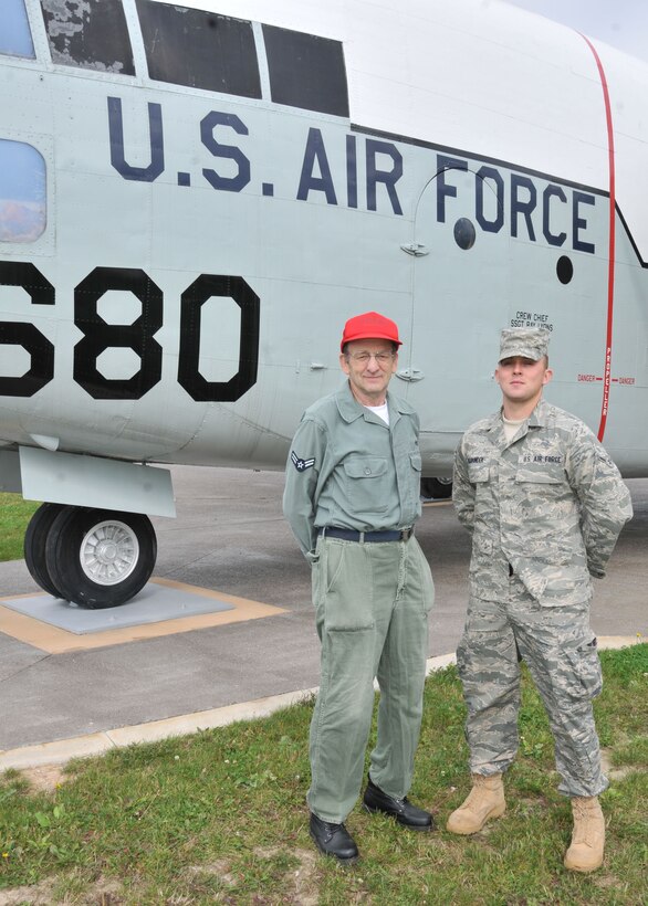 NIAGARA FALLS AIR RESERVE STATION, N.Y- Reed M. Bodine (left) wearing his old uniform with Airman 2nd class rank on the old sage green cotton fatigues uniform of the late 1950s-early 1960s poses with Airman Nick Respondek, Knowledge Operations Management Specialist with the 914th Airlift Wing and the current Airman Battledress Uniform ABU. (U.S. Air Force Reserve photo by Master Sgt. Peter Borys)