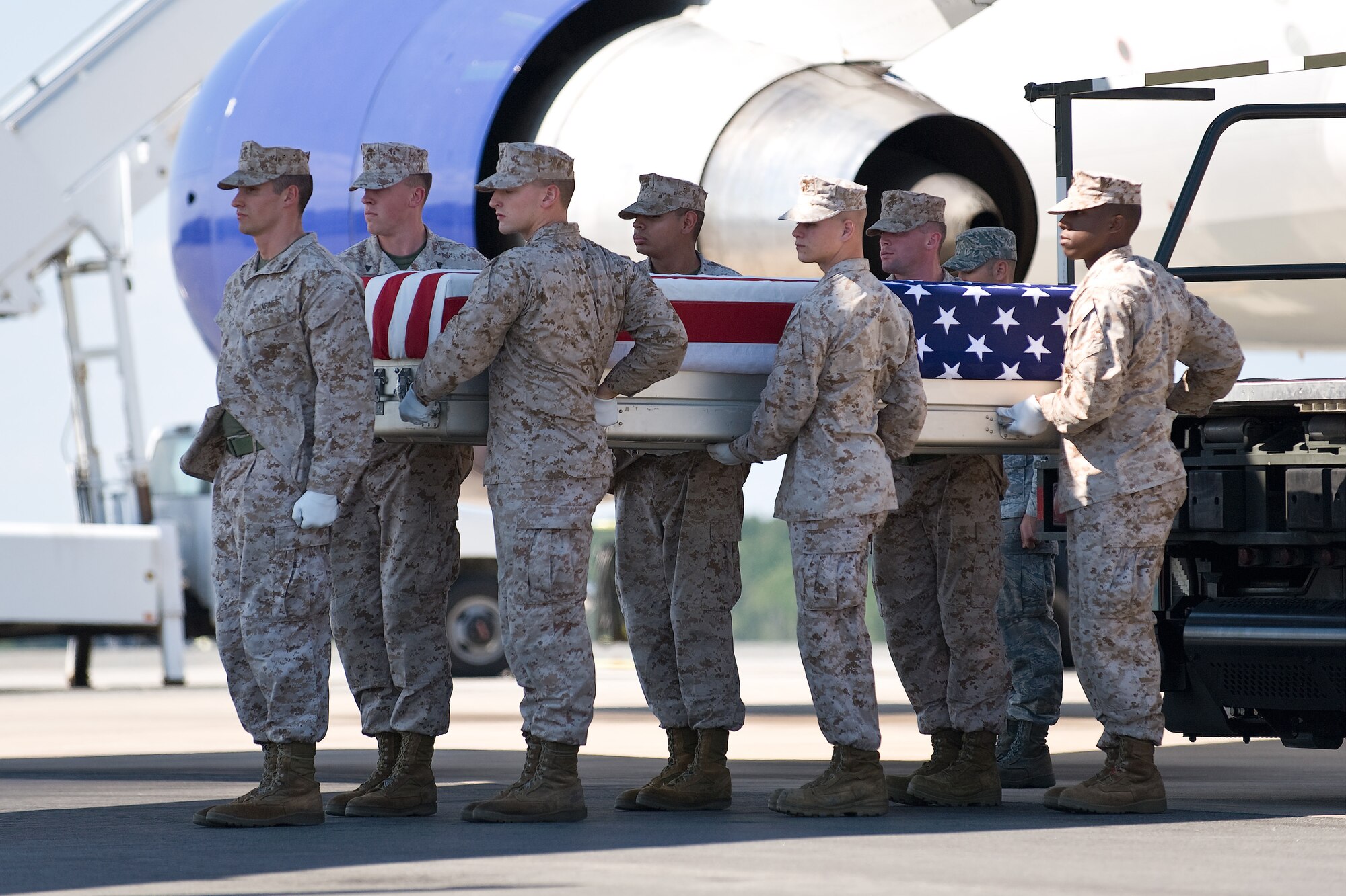 A U.S. Marine Corps team transfers the remains of Marine Corps Sgt. Jesse M. Balthasser, of Columbus, Ohio, at Dover Air Force Base, Del., Sept. 6, 2010. Balthasser was assigned to the 3rd Combat Engineer Battalion, 3rd Marine Division, III Marine Expeditionary Force, Marine Corps Air Ground Combat Center, Twentynine Palms, Calif. (U.S. Air Force photo/Roland Balik)