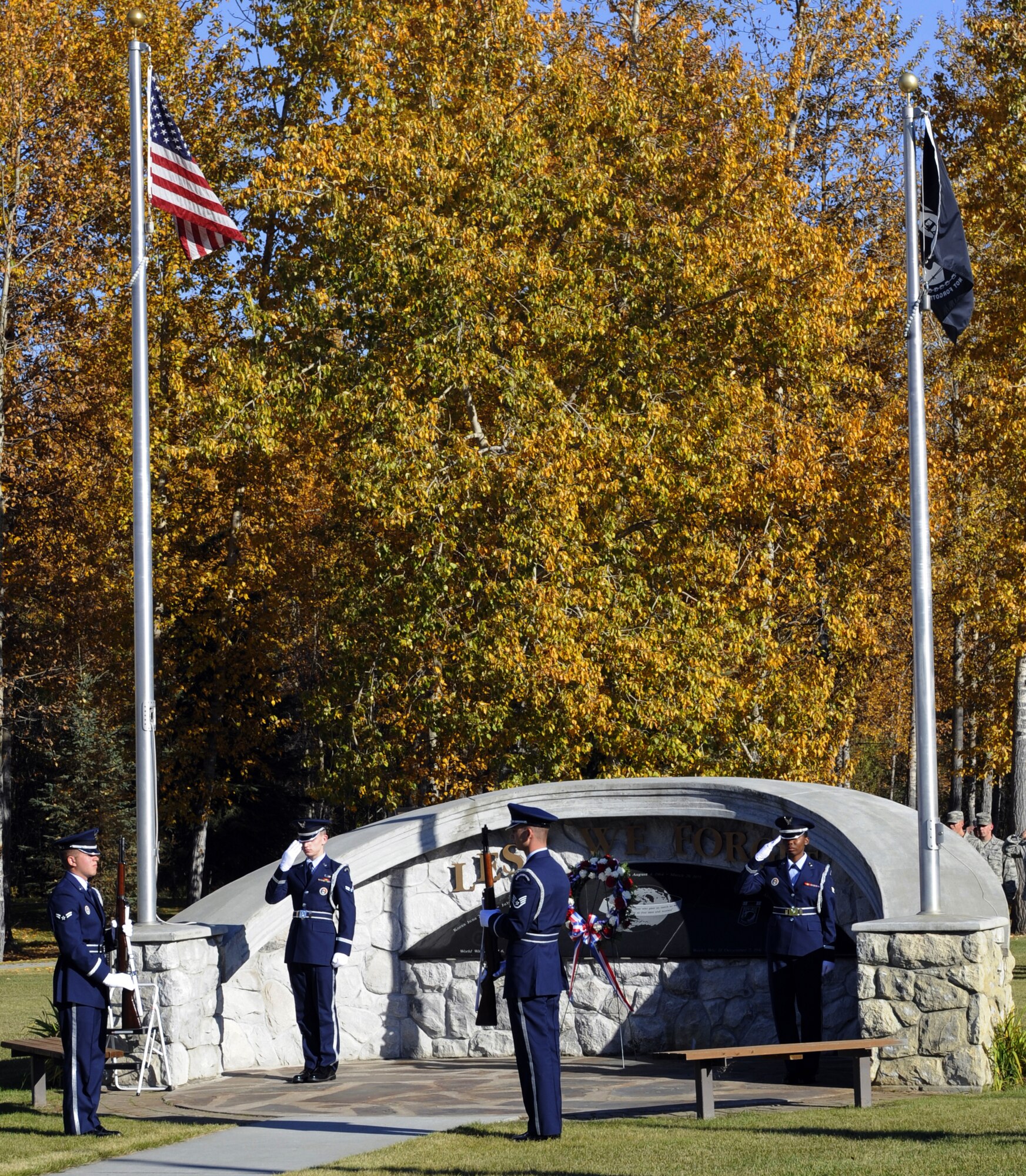Members of the Eielson Air Force Base Honor Guard salute Sept. 17, 2010, Eielson Air Force Base, Alaska. The ceremony was part of the Prisoner of War/Missing in Action Ceremony. The ceremony commemorates troops captured and missing in war. (U.S. Air Force photo/Senior Airman Willard E. Grande II)