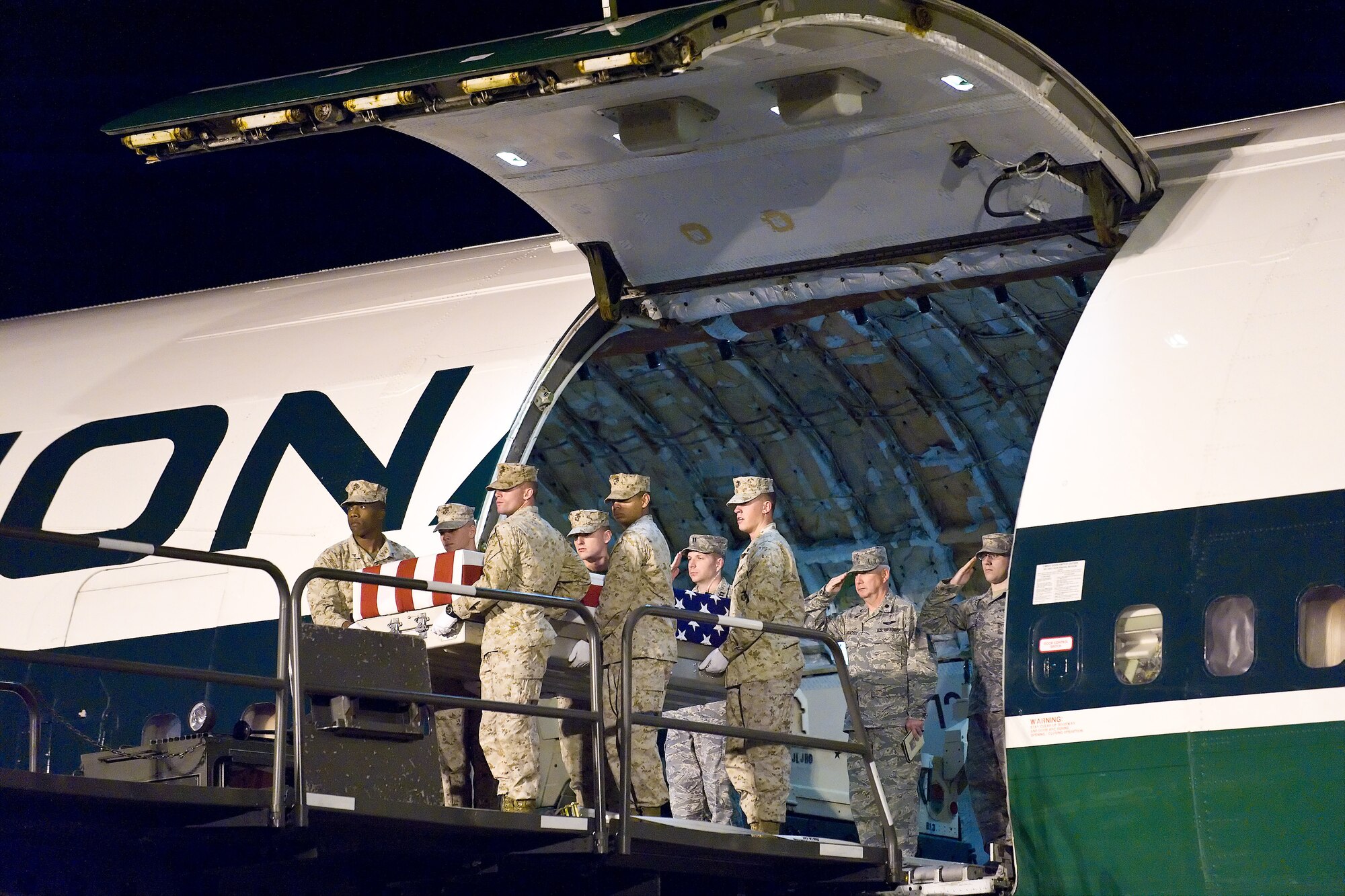 A U.S. Marine Corps team transfers the remains of Marine Corps Lance Cpl. Ross S. Carver, of Rocky Point, N.C., at Dover Air Force Base, Del., Sept. 5, 2010. Carver was assigned to the 2nd Battalion, 6th Marine Regiment, 2nd Marine Division, II Marine Expeditionary Force, Camp Lejeune, N.C. (U.S. Air Force photo/Roland Balik)