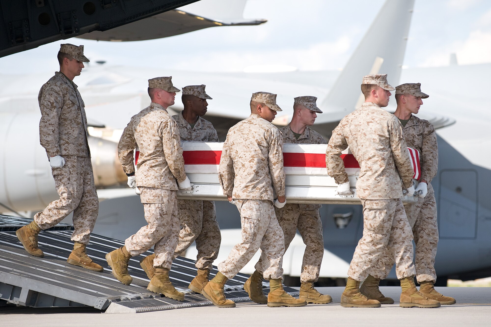 A U.S. Marine Corps team transfers the remains of Marine Corps Lance Cpl. Joshua T. Twigg, of Indiana, Pa., at Dover Air Force Base, Del., Sept. 4, 2010. Twigg was assigned to the 2nd Battalion, 9th Marine Regiment, 2nd Marine Division, II Marine Expeditionary Force, Camp Lejeune, N.C.  (U.S. Air Force photo/Roland Balik)