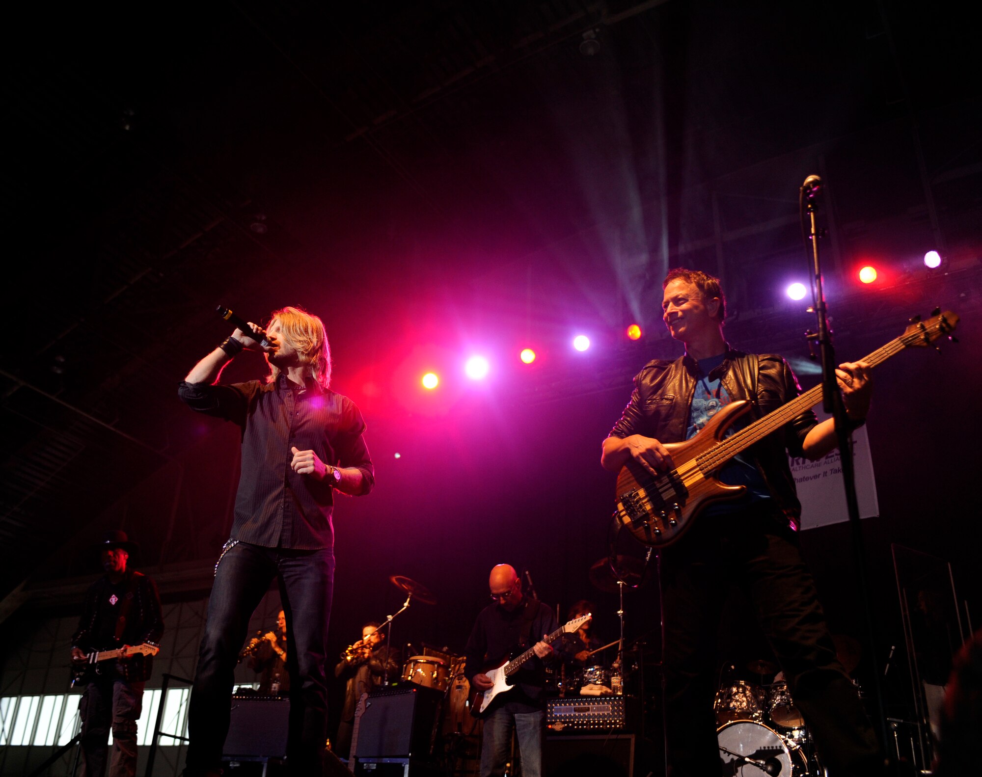 Gary Sinise and the Lt. Dan Band play during a USO Show Sept. 18, 2010, Eielson Air Force Base, Alaska. Mr. Sinise and the Lt. Dan Band play USO Shows all around the country. Mr. Sinise is an actor and musician. (U.S. Air Force photo/Senior Airman Willard E. Grande II)