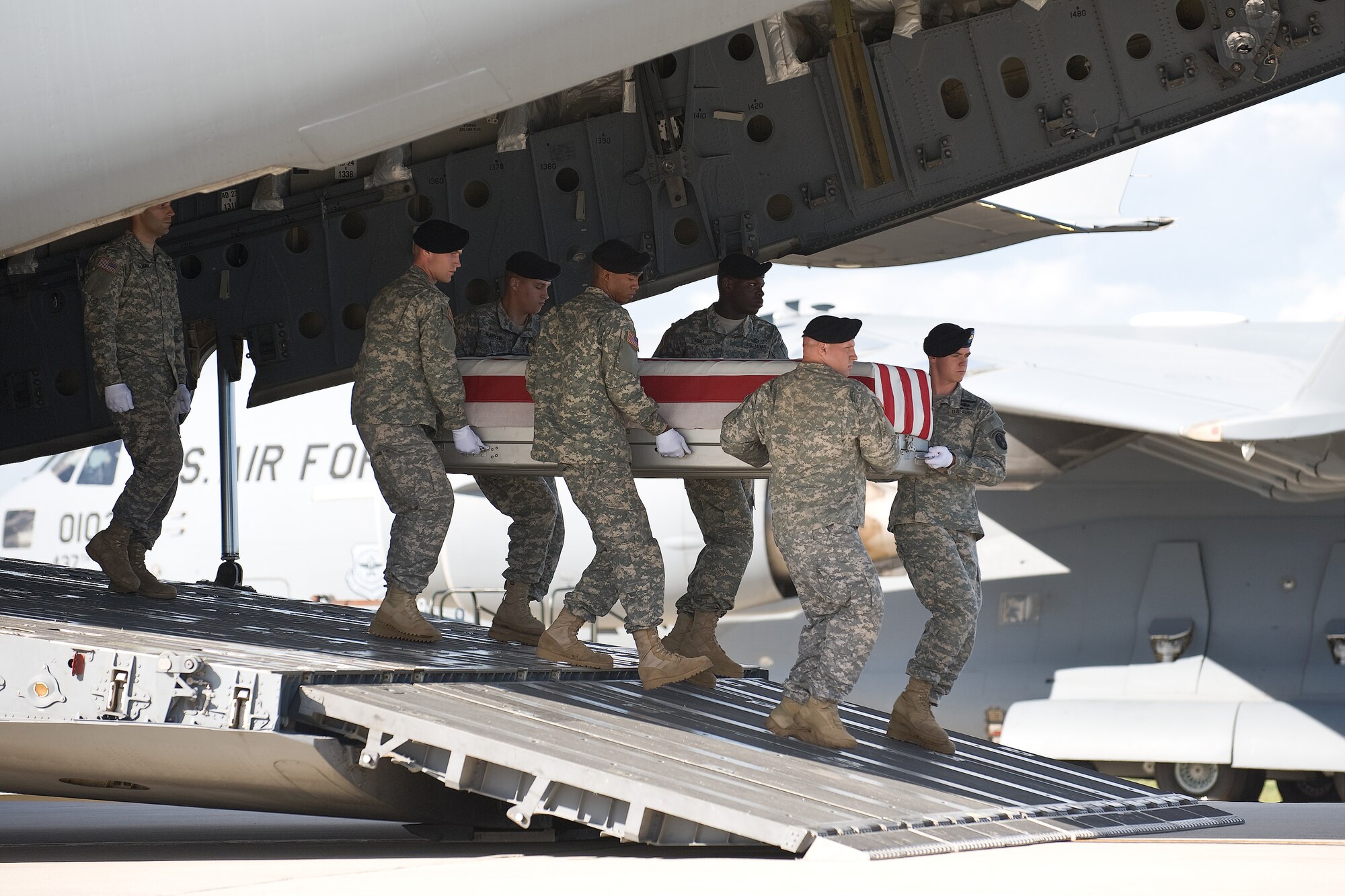 A U.S. Army carry team transfers the remains of Army Pfc. Diego M. Montoya, of San Antonio, Texas, at Dover Air Force Base, Del., Sept. 4, 2010.  Montoya was assigned to the 720th Military Police Battalion, 89th Military Police Brigade, Fort Hood, Texas. (U.S. Air Force photo/Roland Balik)