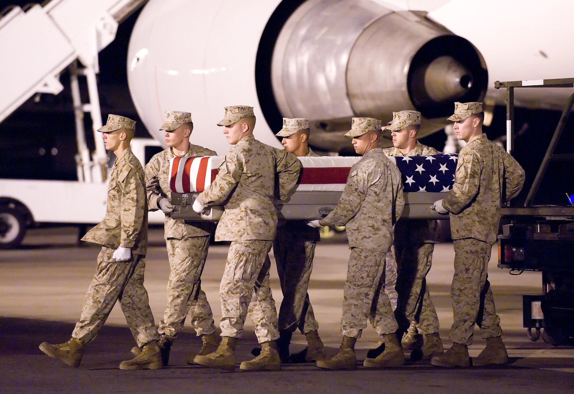A U.S. Marine Corps carry team transfers the remains of Marine Cpl. Philip G. E. Charte of Goffstown, N.H., at Dover Air Force Base, Del., Sept. 9, 2010.  Charte was assigned to the 2nd Battalion, 6th Marine Regiment, 2nd Marine Division, II Marine Expeditionary Force, Camp Lejeune, N.C. He died Sept. 7 while conducting combat operations in Helmand province, Afghanistan. (U.S. Air Force photo/Jason Minto)