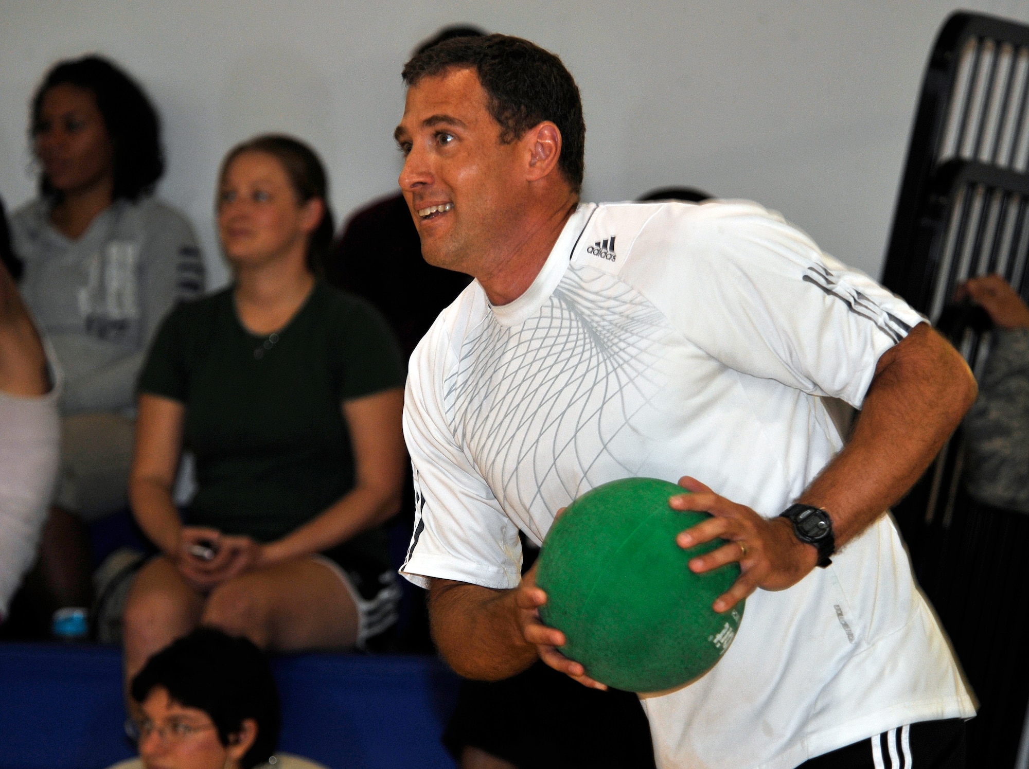 HOLLOMAN AIR FORCE BASE, N.M. -- Col. David Krumm, 49th Wing commander, prepares to throw his dodge ball during Sports Day, Sept. 17, 2010. Airmen from different squadrons participated in a game of dodge ball, with five members from each team going head-to-head to try to knock-out their opponents without getting hit. (U.S. Air Force photo by Senior Airman Veronica Stamps / Released)